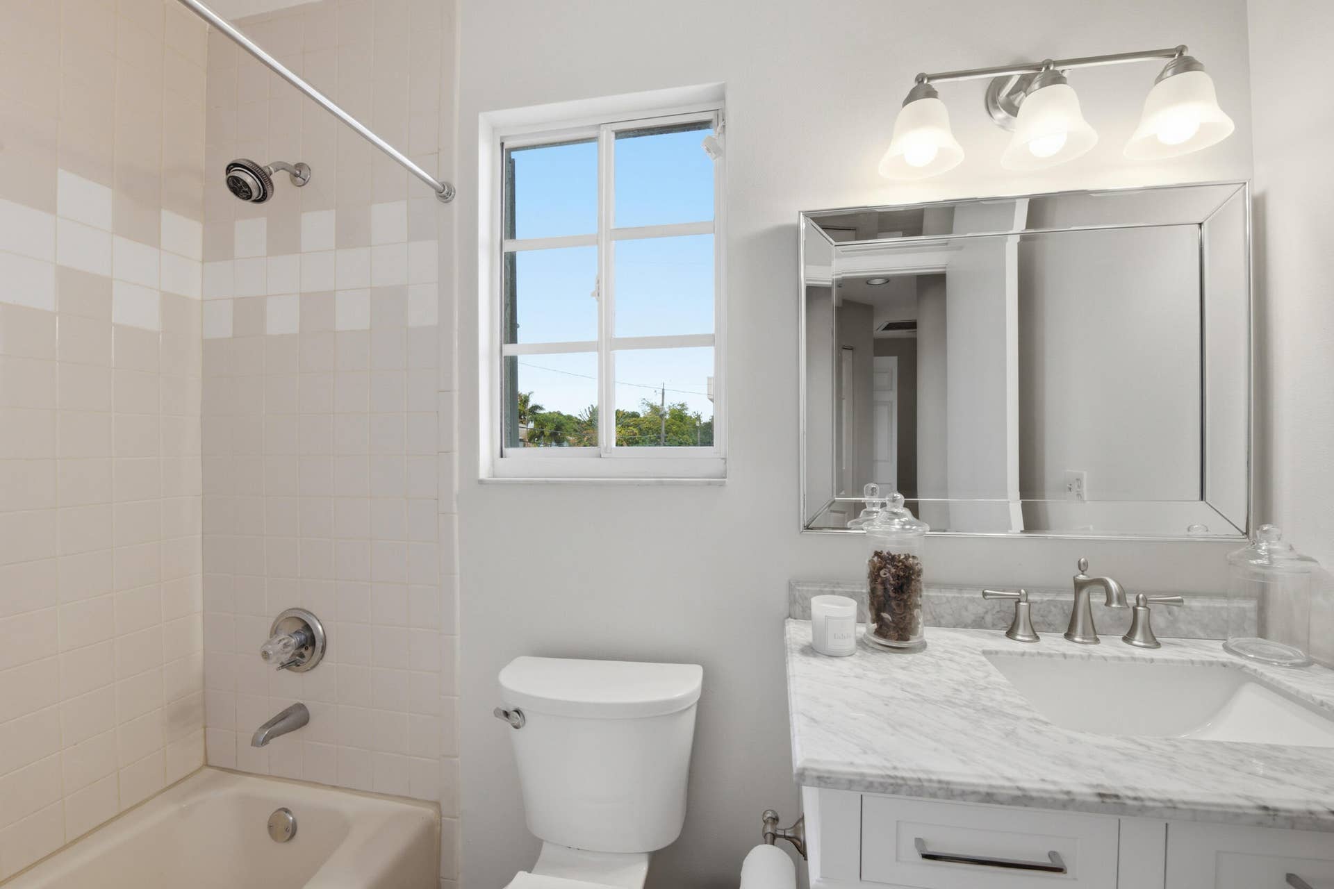 917 NE 3RD Street, #9, Fort Lauderdale, Fort Lauderdale, FL 33301 Bathroom vanity with a white rectangular undermount sink, brushed nickel widespread faucet, and a stone countertop