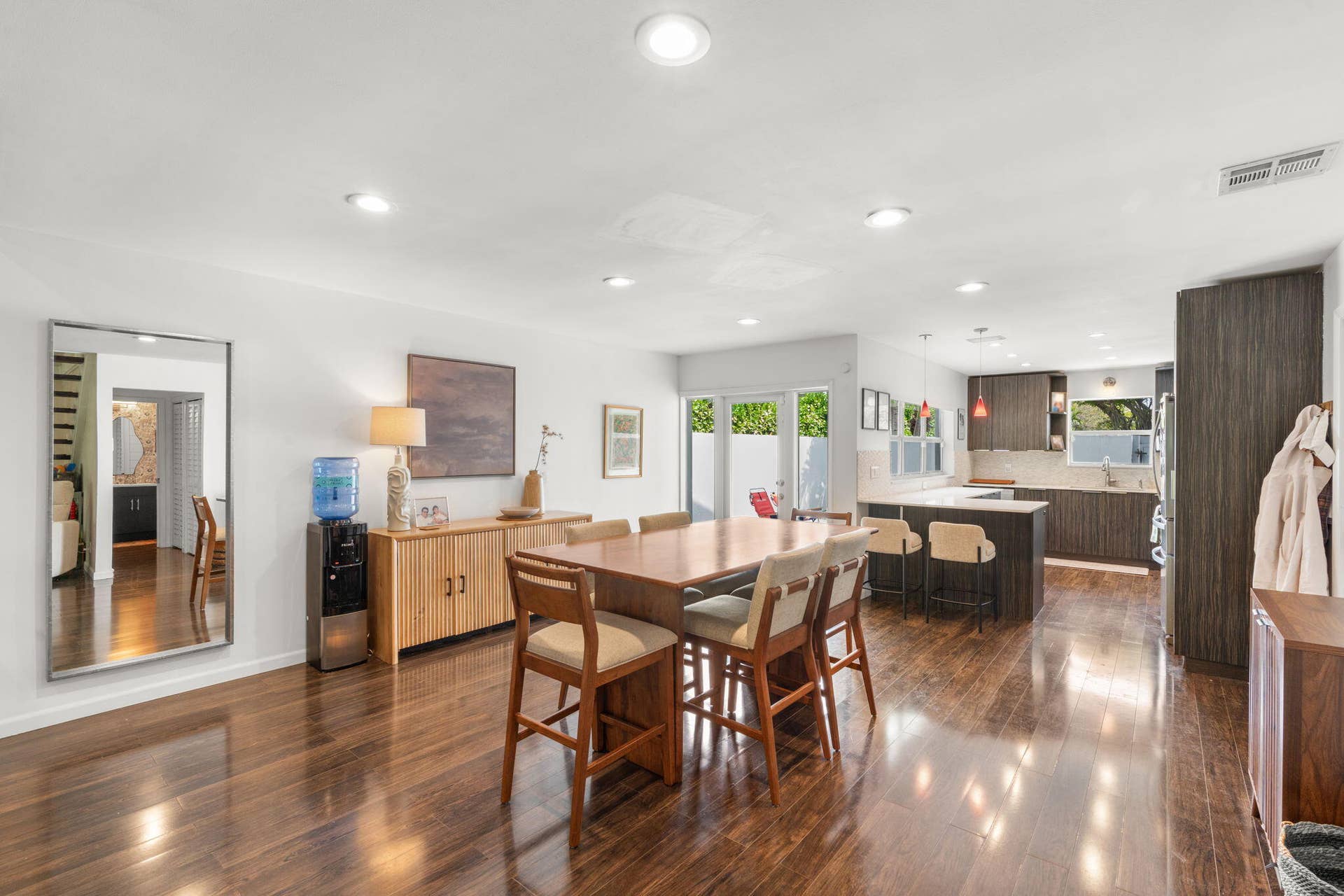 2956 FLORIDA Boulevard, Delray Beach, Delray Beach, FL 33483 Open dining area with laminate wood plank flooring, recessed lighting, and direct connection to the kitchen and outdoor courtyard access.