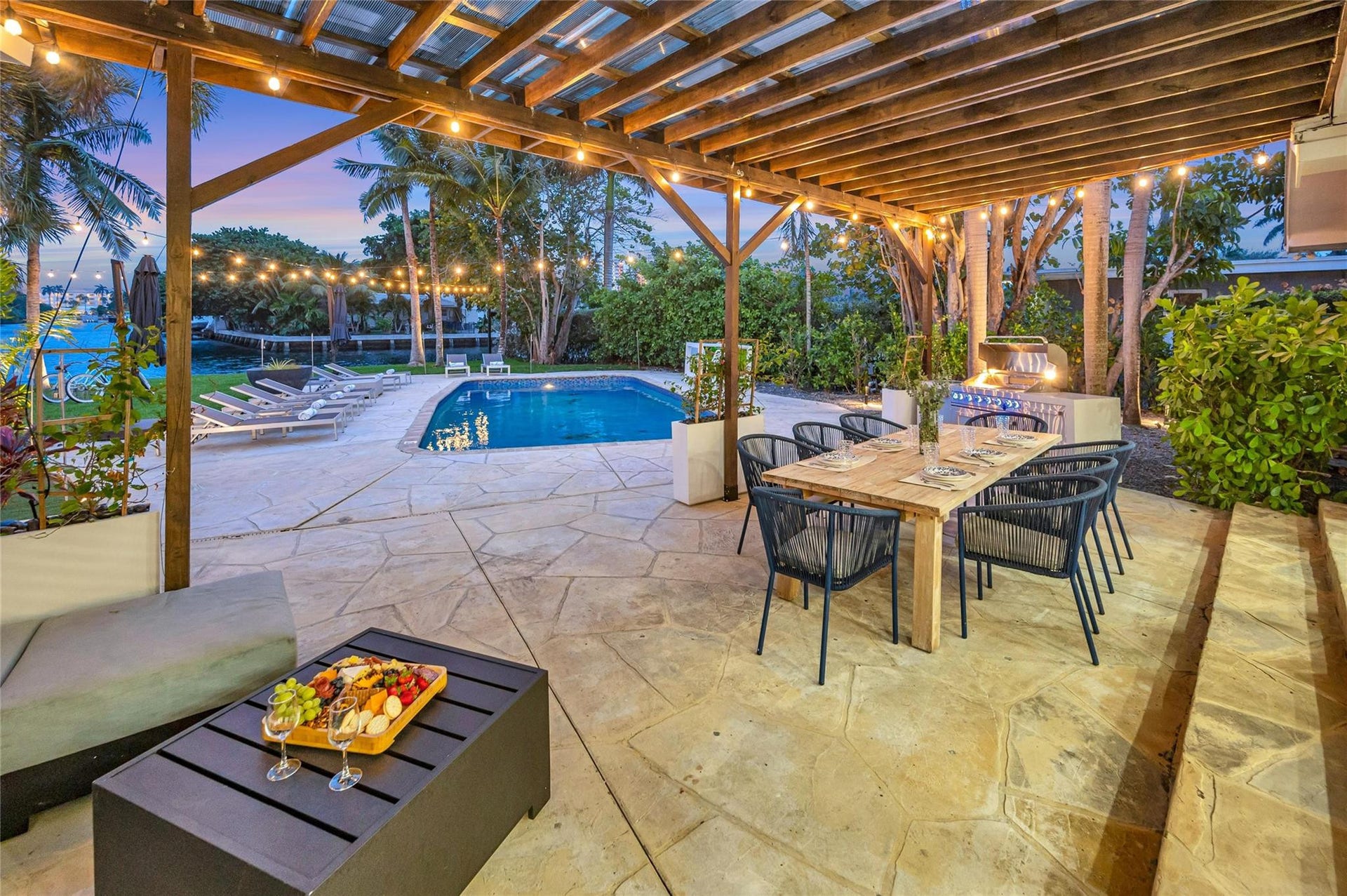 15x30 covered patio space, Natural gas Grill space with prep area on each side, Electric outlets and lighting.