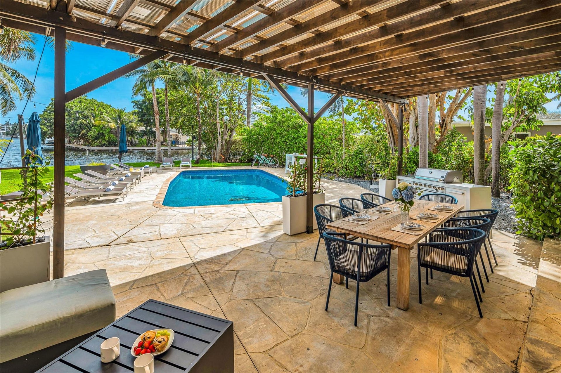 15x30 covered patio space, Natural gas Grill space with prep area on each side, Electric outlets and lighting.