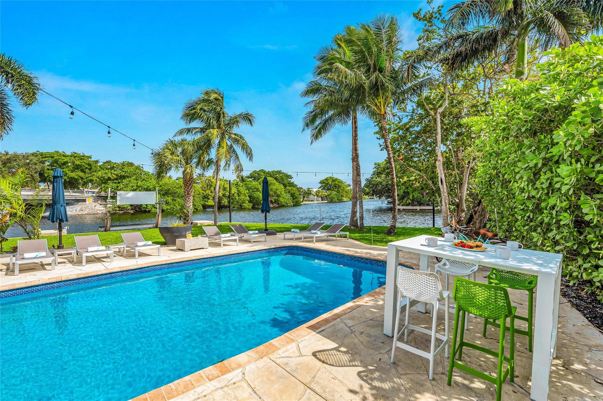 15x 30 heated pool with New Jandy pool equipment: variable-speed pump, salt system, iAqualink Wi-Fi control Fully renovated landscaping with new sod, Palm trees, flowers and plants, Wi-Fi-enabled sprinkler system, Custom landscape lighting including overhead string lights