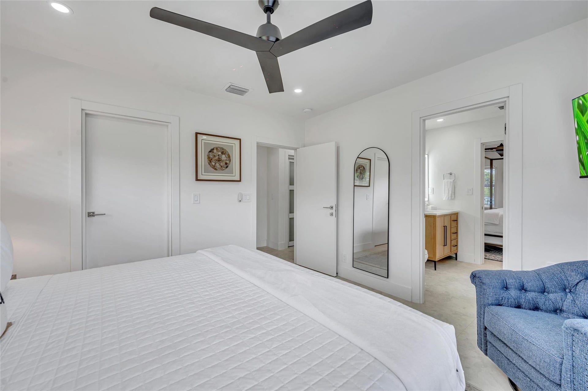 guest bedroom #3 has direct access to guest bathroom. features large walk in closet, ceiling fan, and tons of natural light!