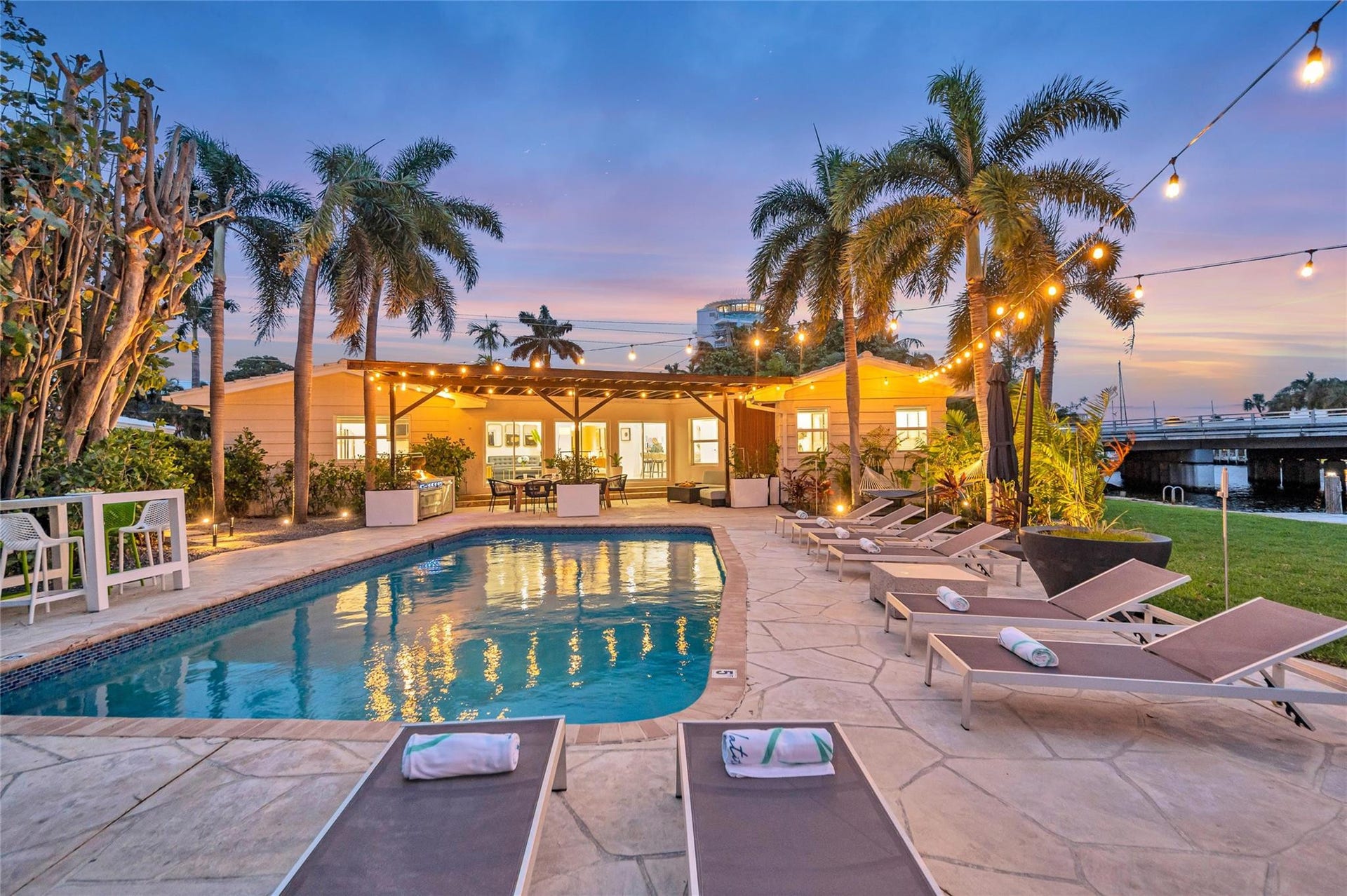 15x 30 heated pool with New Jandy pool equipment: variable-speed pump, salt system, iAqualink Wi-Fi control Fully renovated landscaping with new sod, Palm trees, flowers and plants, Wi-Fi-enabled sprinkler system, Custom landscape lighting including overhead string lights