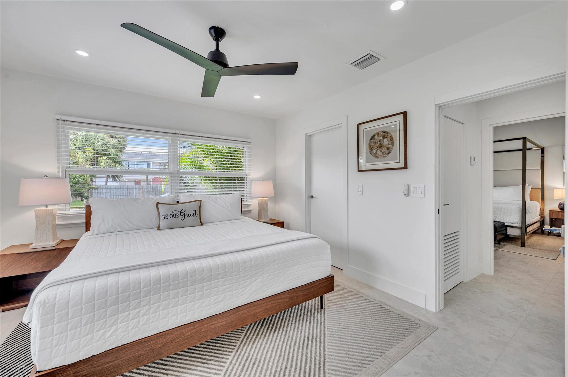 guest bedroom #3 has direct access to guest bathroom. features large walk in closet, ceiling fan, and tons of natural light!