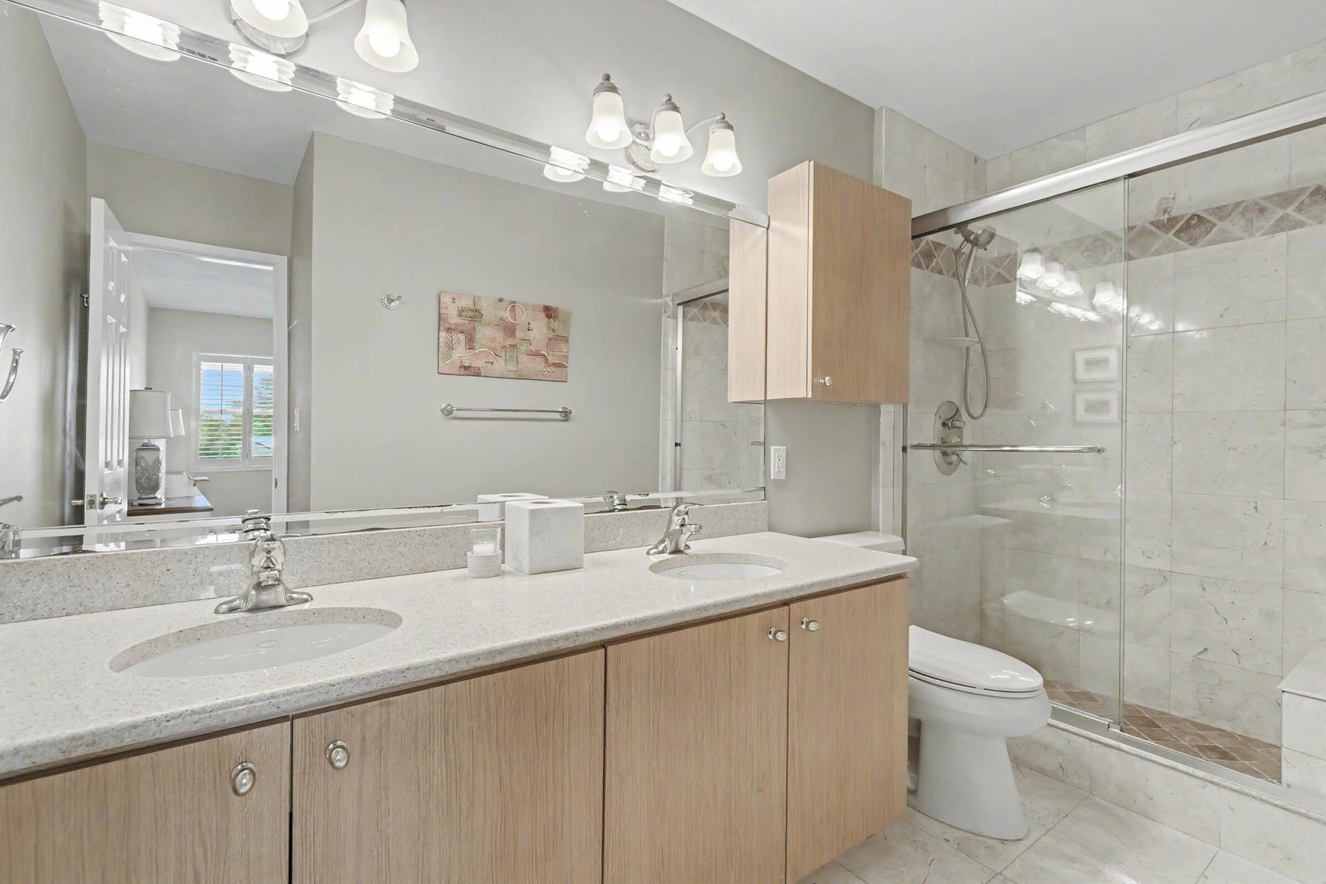 298 SE 6th Avenue, #18, Pompano Beach, FL 33060 Primary bath features double sink vanity.