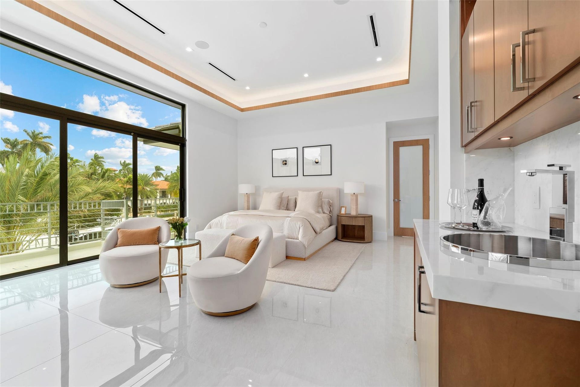 Second-Floor Primary Bedroom with Sitting Area, Beverage Refrigerator, and Beautiful Water Views