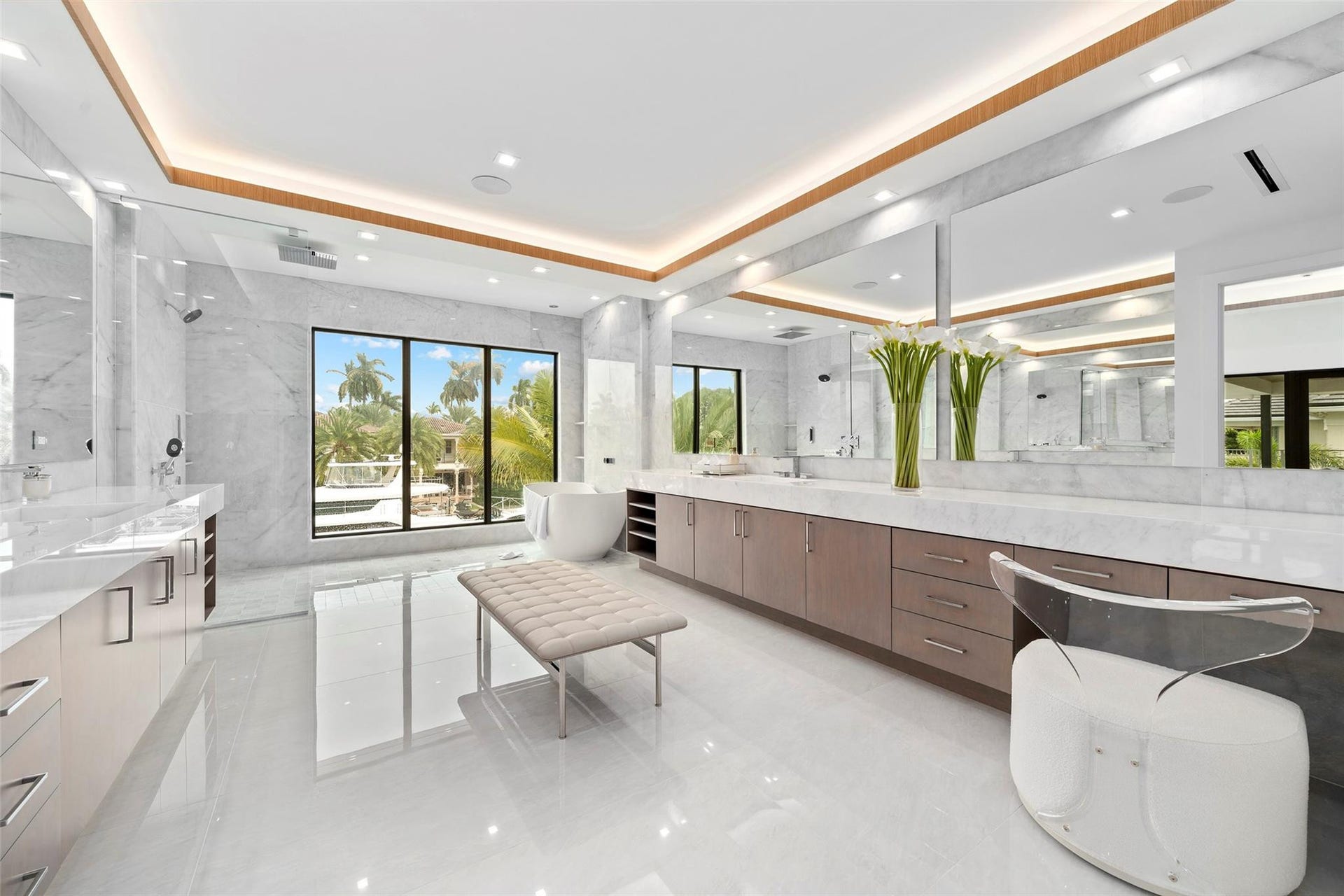 Spacious Primary Bathroom with Spectacular Water Views, Separate Vanities, and Luxurious Finishes