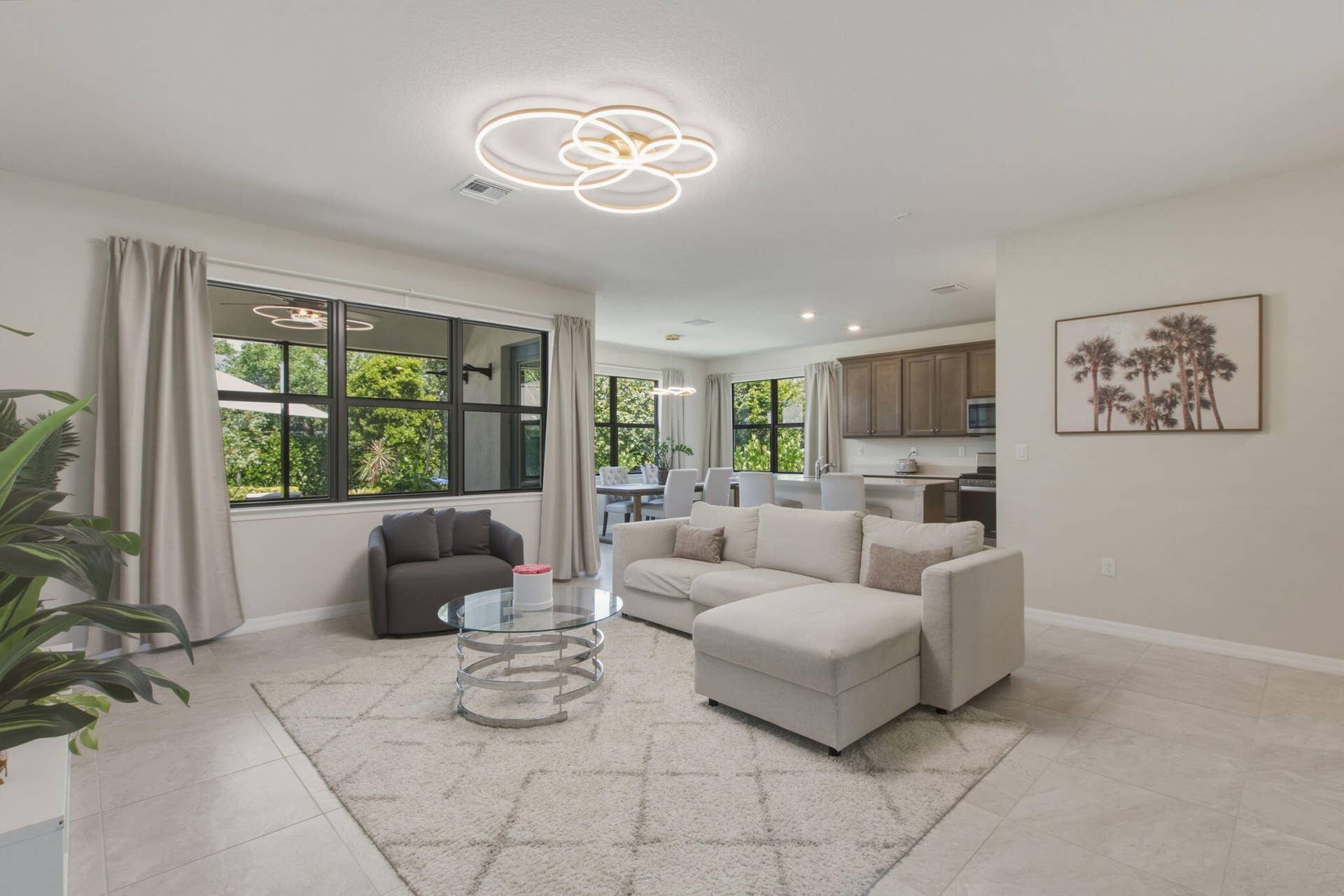 4601 Pinehurst Trail E, Oakland Park, FL 33309 Open-concept living area with large windows, light tile flooring, and recessed lighting