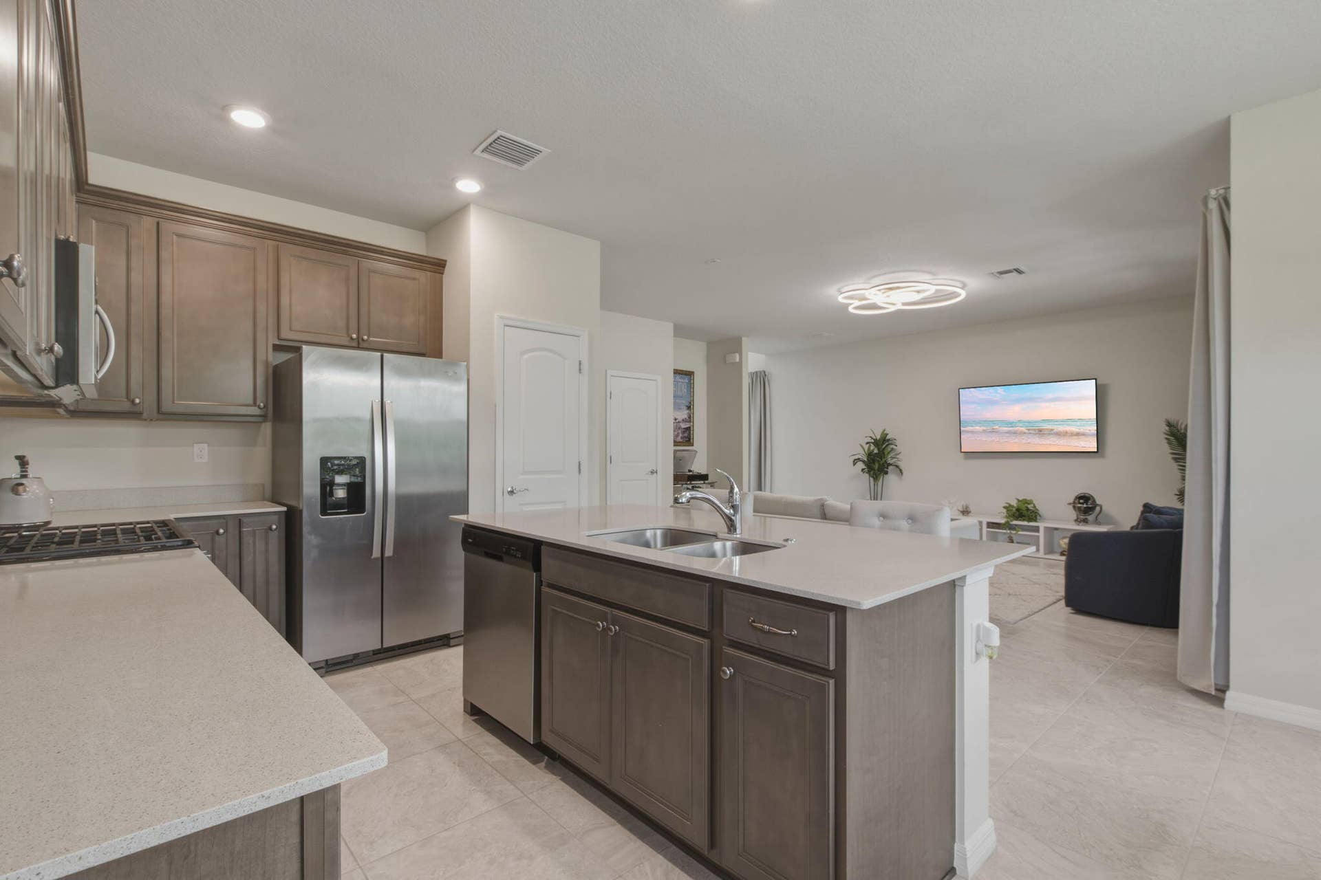 4601 Pinehurst Trail E, Oakland Park, FL 33309 Kitchen with a central island featuring a stainless steel sink and a stainless steel dishwasher