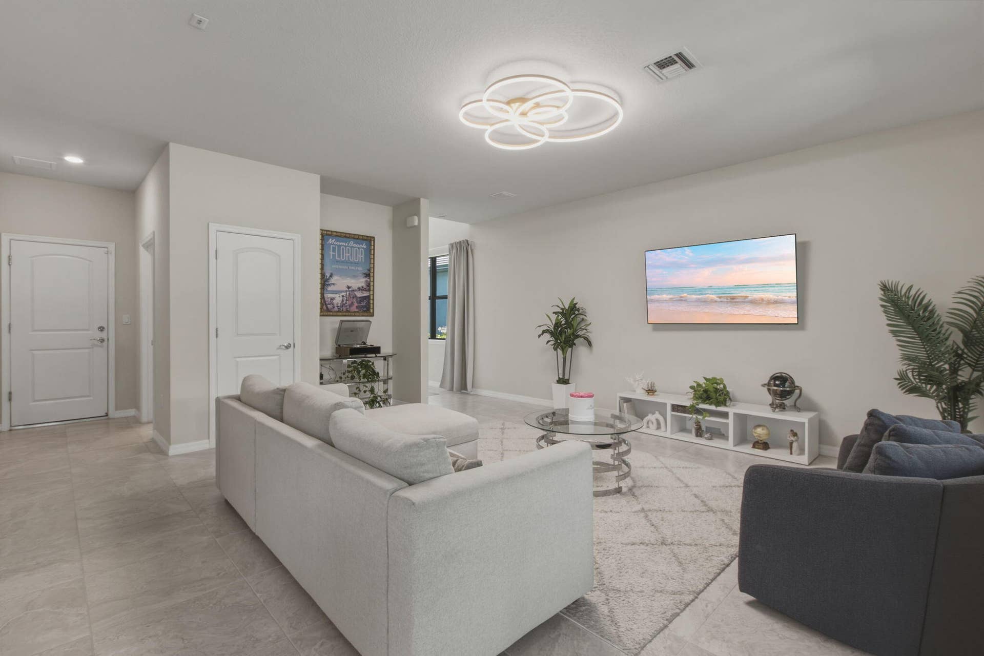 4601 Pinehurst Trail E, Oakland Park, FL 33309 Open-concept living space with light-toned walls and large format tile flooring