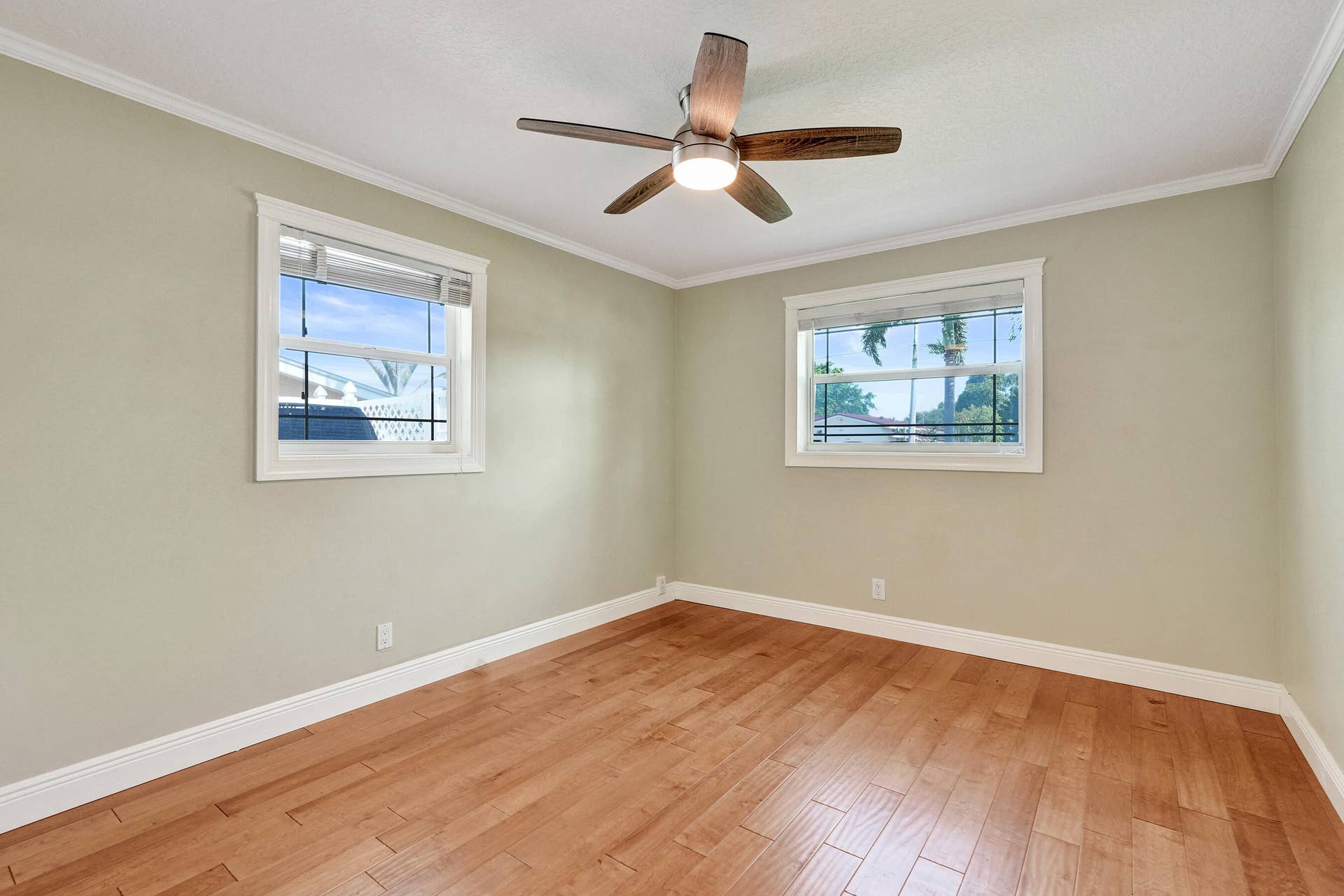733 JACANA Way, North Palm Beach, FL 33408 Corner bedroom with wood flooring. This room measures 10'9 x 13.