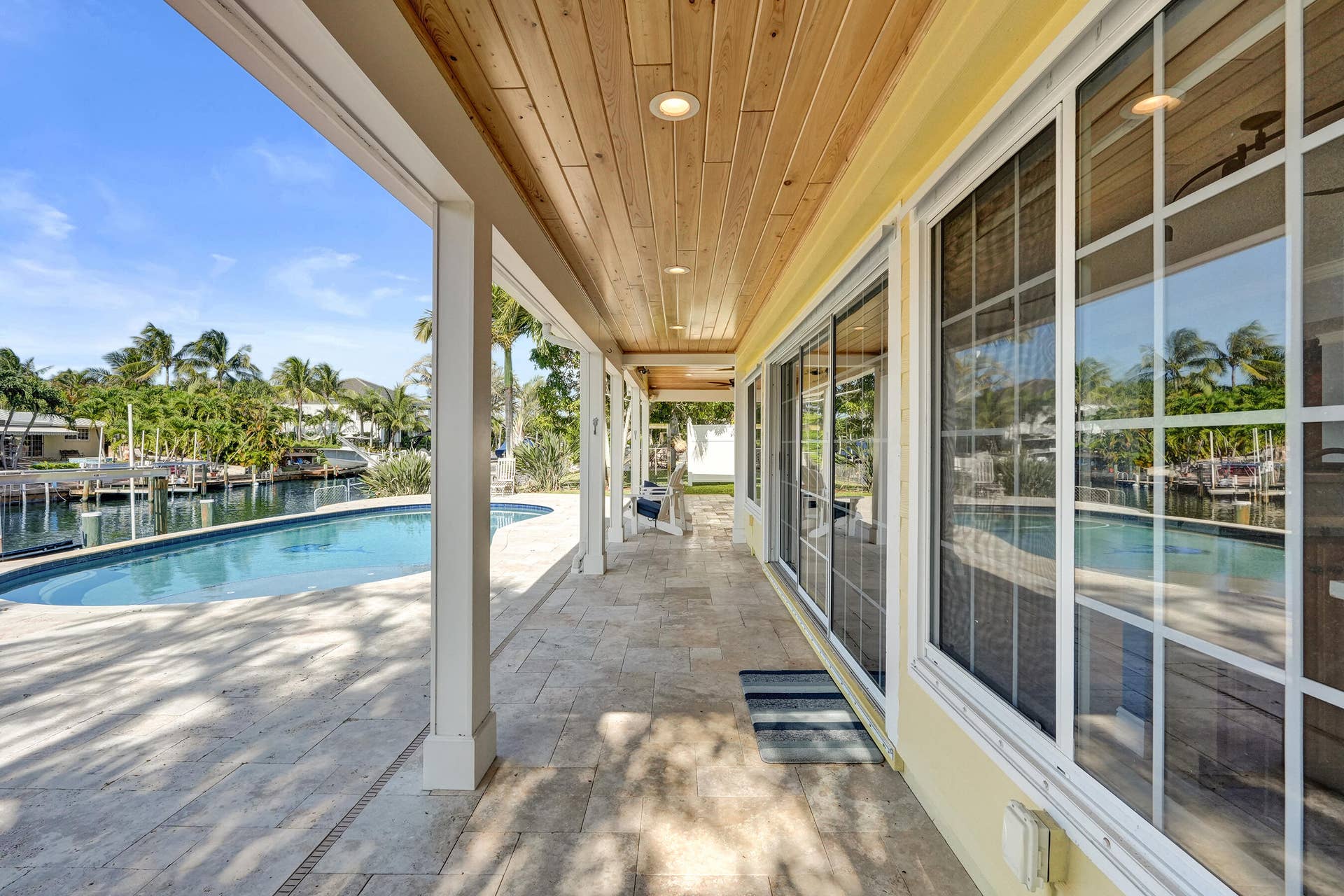 733 JACANA Way, North Palm Beach, FL 33408 Covered patio with T&G Ceilings. This walkway measures 25'3 x 5'5.