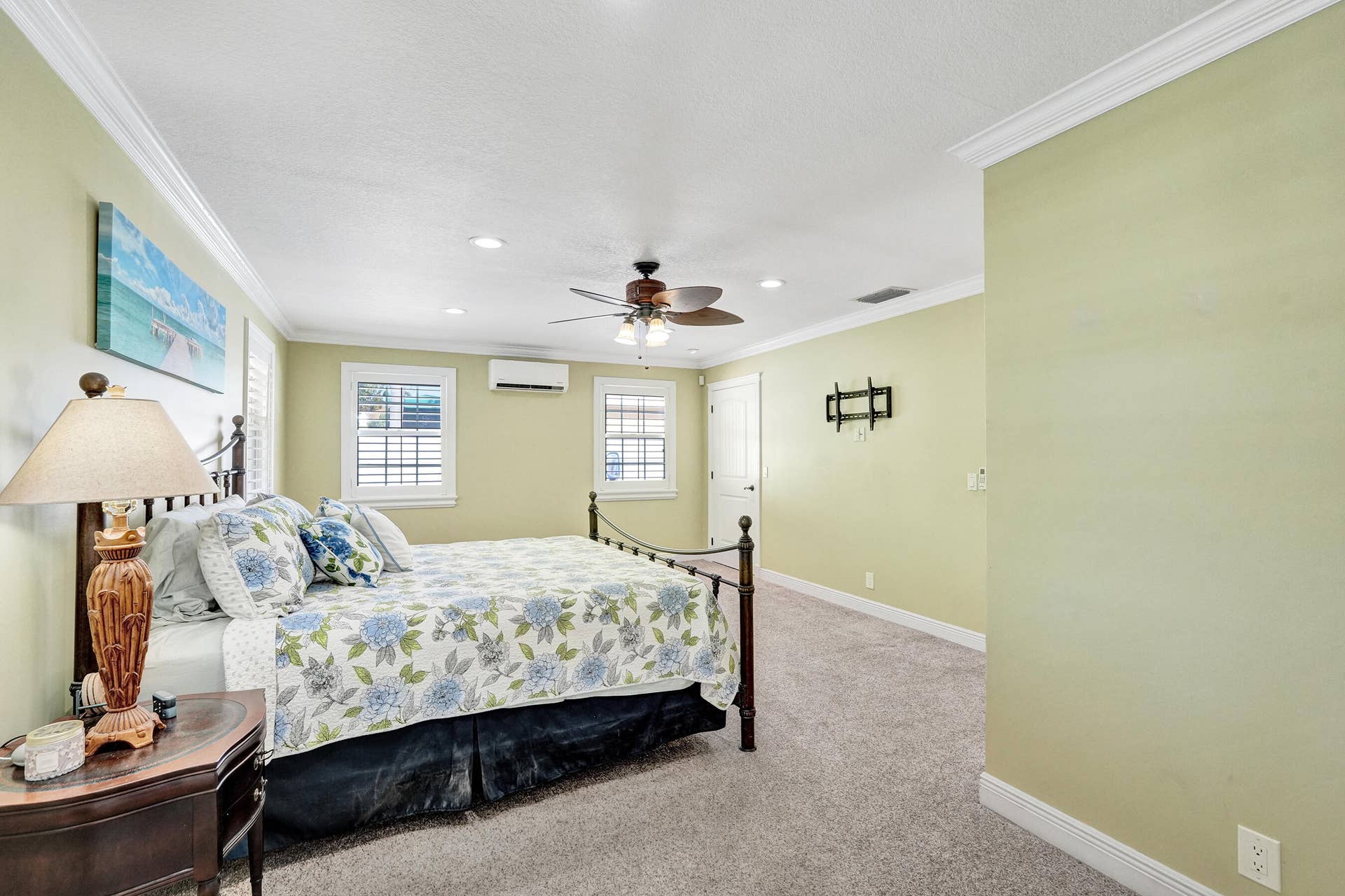 733 JACANA Way, North Palm Beach, FL 33408 Huge 21' x 18' Master bedroom featuring crown molding, recessed lighting, a ceiling fan, 3 closets and windows with plantation shutters.