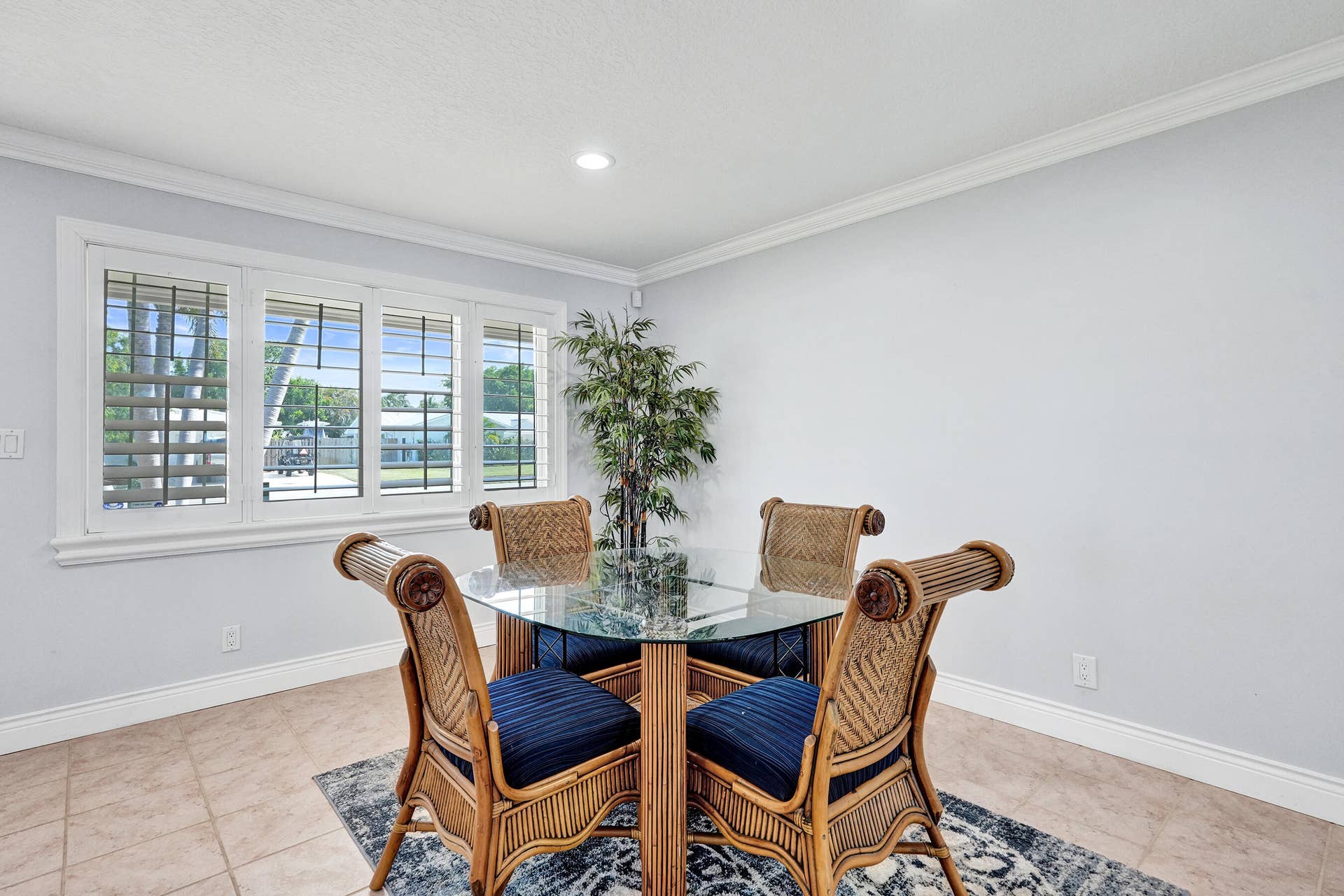 733 JACANA Way, North Palm Beach, FL 33408 Four-panel window with plantation shutters. Dining table is here, but could easily be in the Family room.
