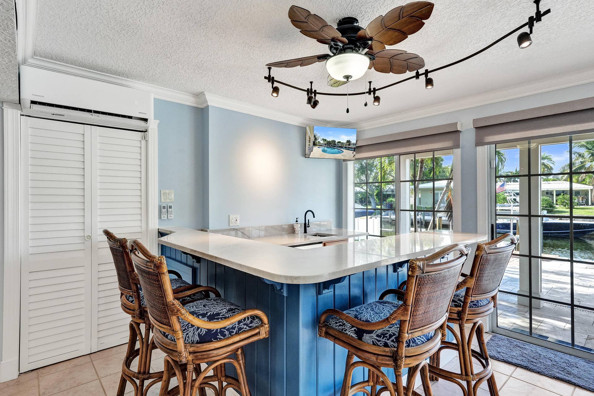733 JACANA Way, North Palm Beach, FL 33408 Custom built wet bar with beverage fridge and quartzite countertop.
