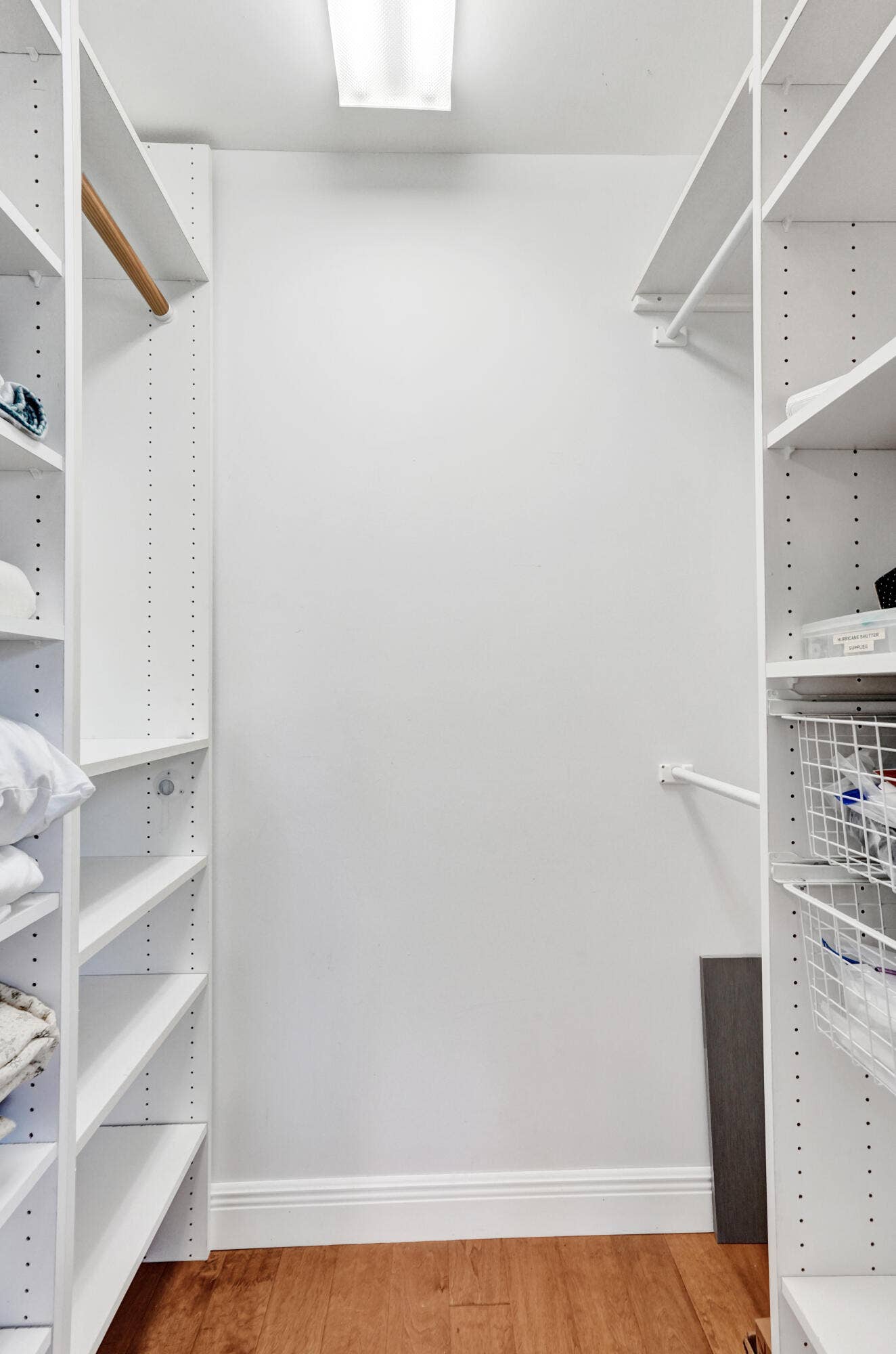 733 JACANA Way, North Palm Beach, FL 33408 Custom closet system featuring multiple adjustable shelves, a clothes rod, and wire basket drawers