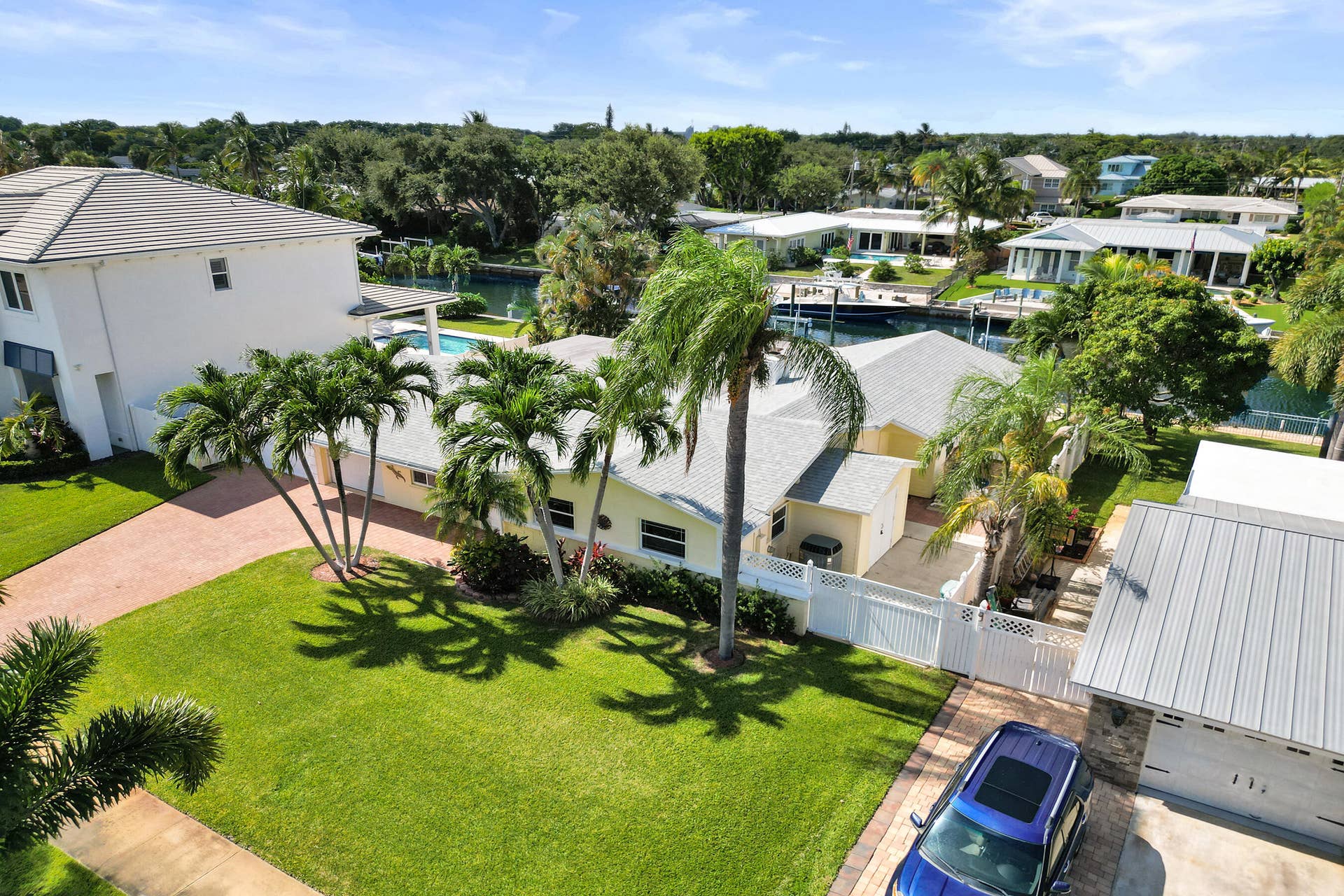 733 JACANA Way, North Palm Beach, FL 33408 Private pavered side yard with built-in storage / lawn equipment shed. Natural gas plumbing is on the east side of the home.