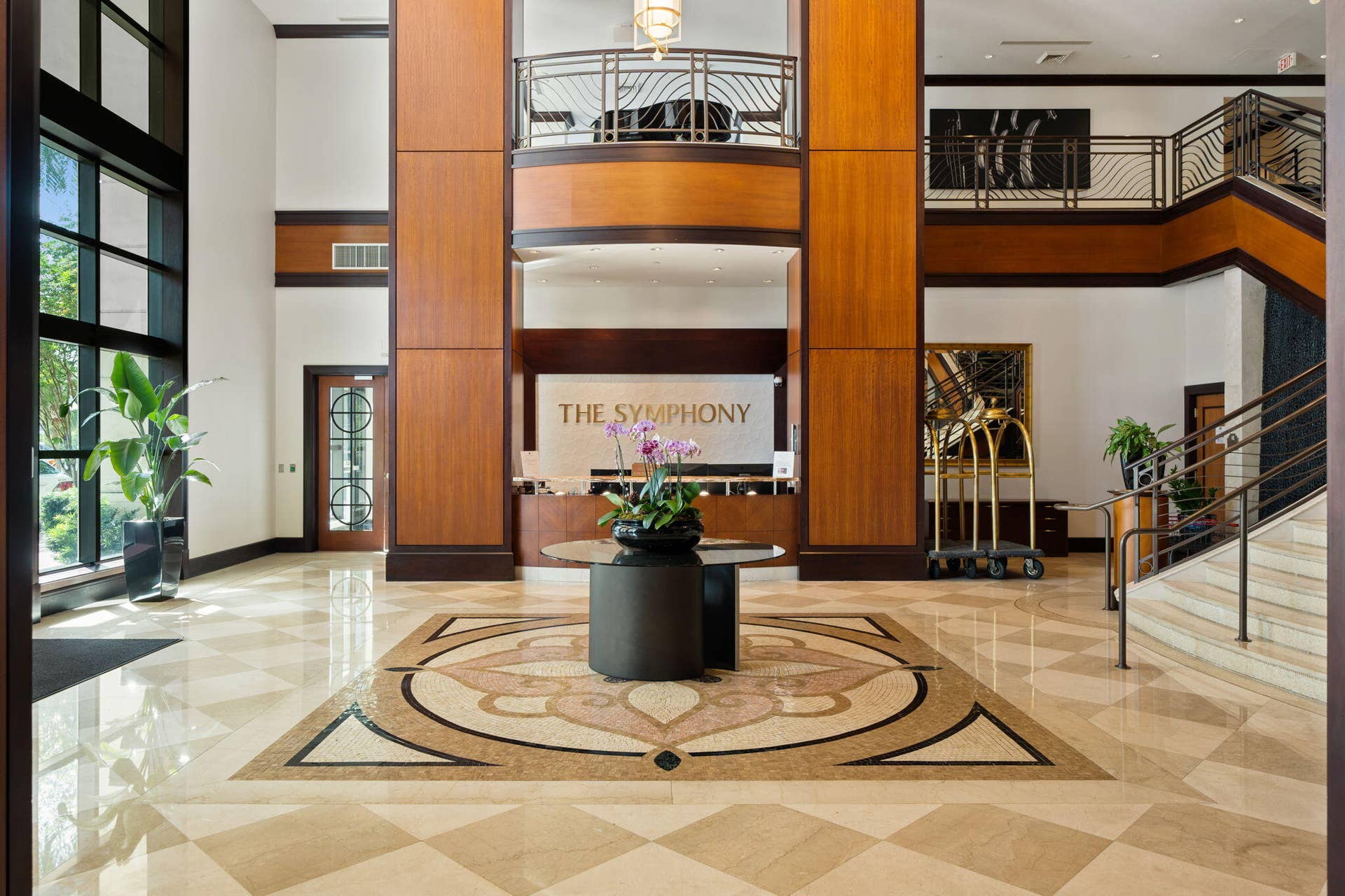 610 W Las Olas Boulevard, #115N, Fort Lauderdale, FL 33312 Elegant lobby with front desk, mosaic marble flooring, architectural wood detailing & valet service.