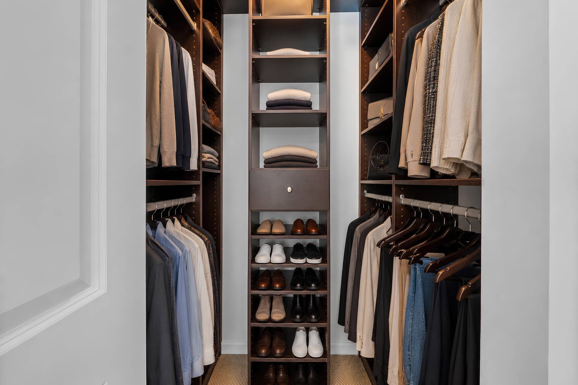 610 W Las Olas Boulevard, #115N, Fort Lauderdale, FL 33312 Walk-in closet with custom built-in shelving, drawers, hanging space & dedicated shoe storage for organized everyday living.