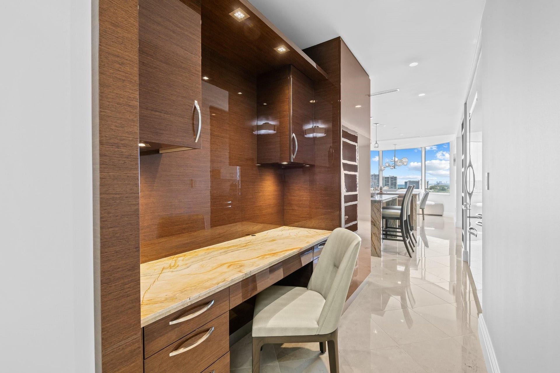 3055 Harbor Drive, #1403, Fort Lauderdale, FL 33316 Built-in wood-finish cabinetry and desk with stone countertop