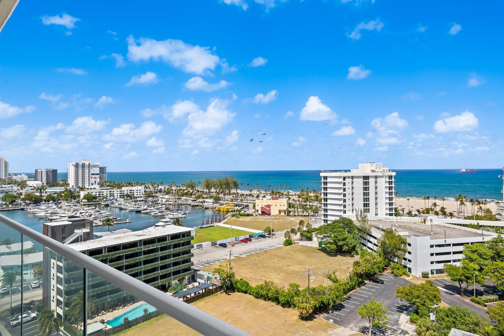 3055 Harbor Drive, #1403, Fort Lauderdale, FL 33316 Expansive water and city vistas from a glass-paneled balcony