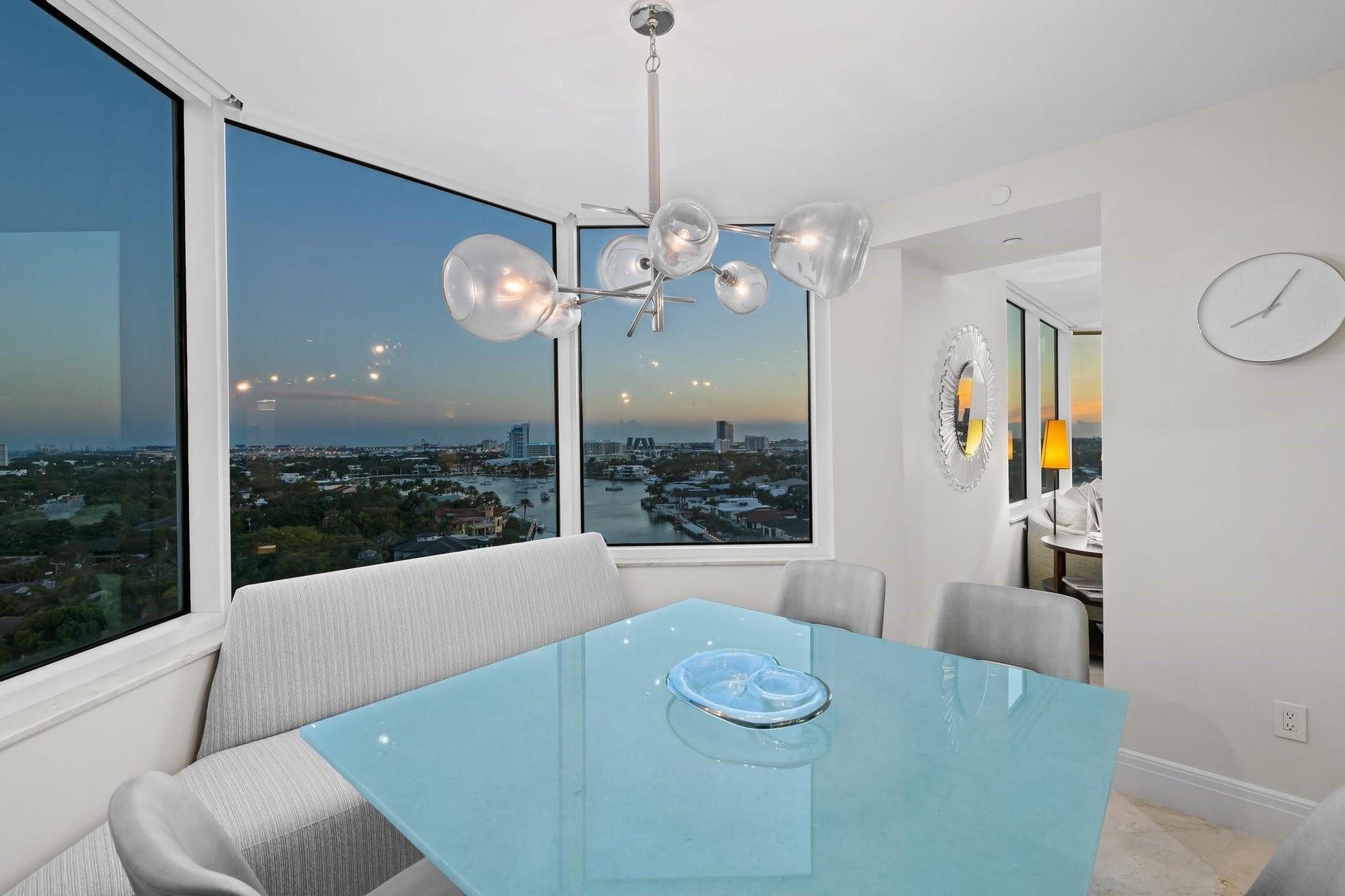 3055 Harbor Drive, #1403, Fort Lauderdale, FL 33316 Panoramic corner windows frame city and water views at sunset