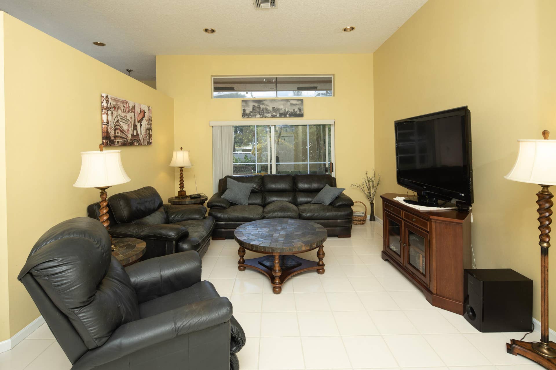 Comfortable family room with an open layout, abundant natural light, and easy access to the kitchen and outdoor living areas.