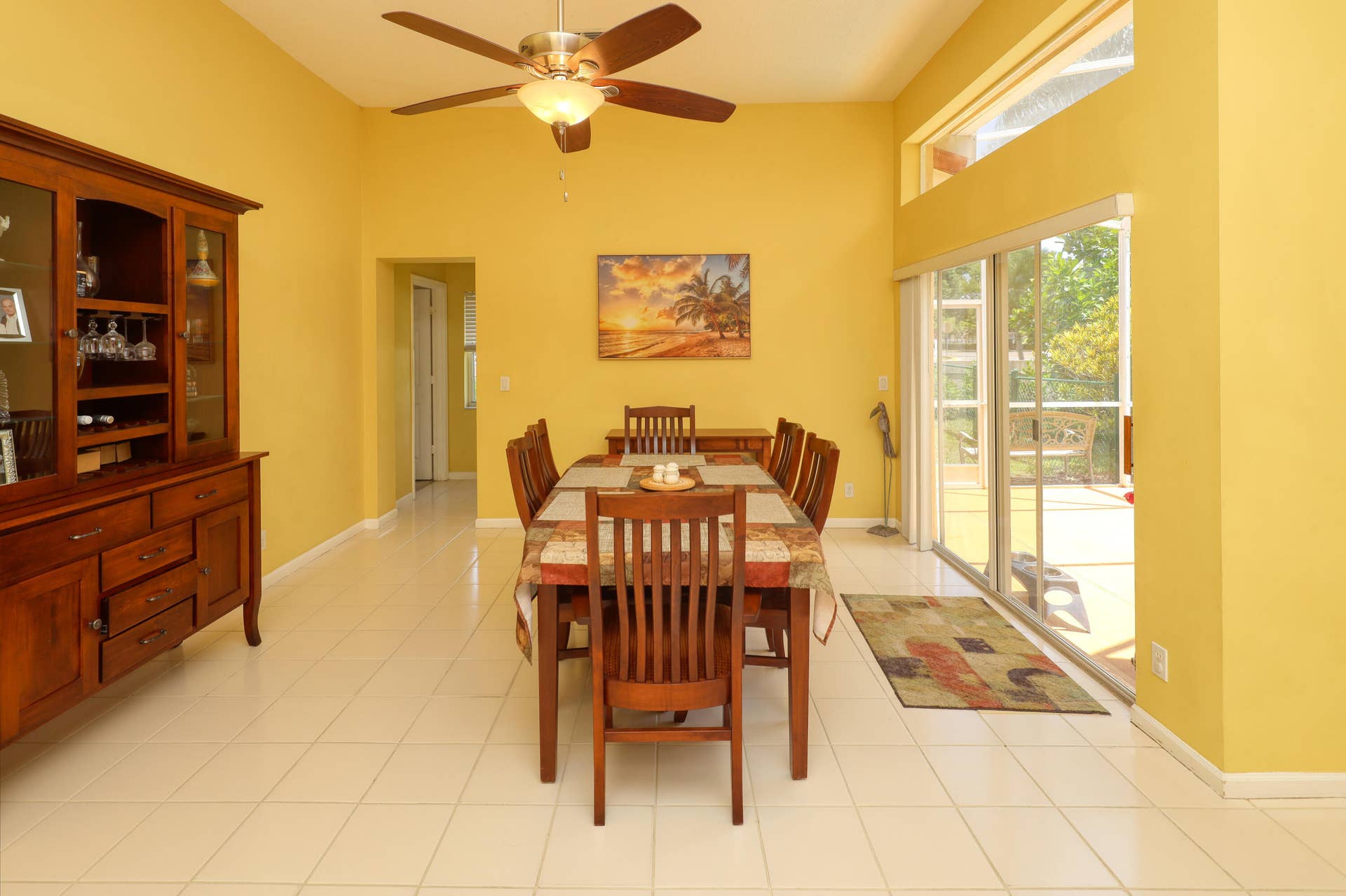 Open dining area featuring high ceilings and seamless flow to the family room and outdoor entertaining spaces.