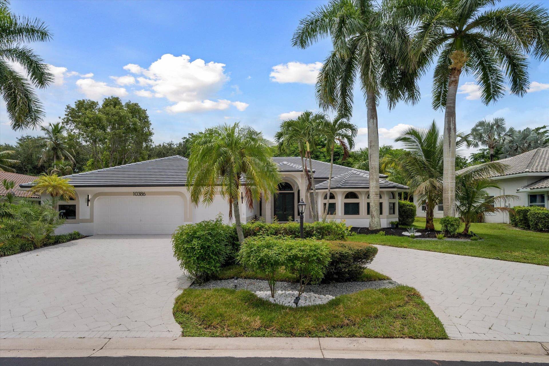 Welcome home: circular driveway, pretty landscaping!