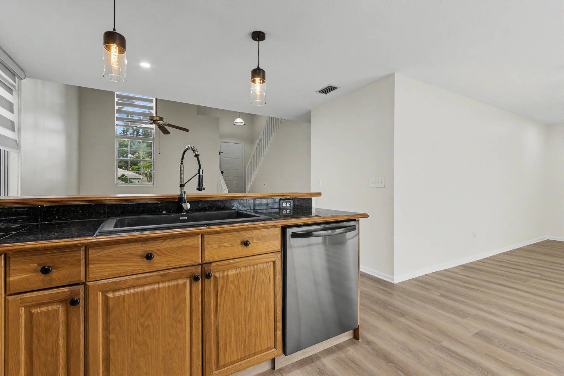 Kitchen with island to living room