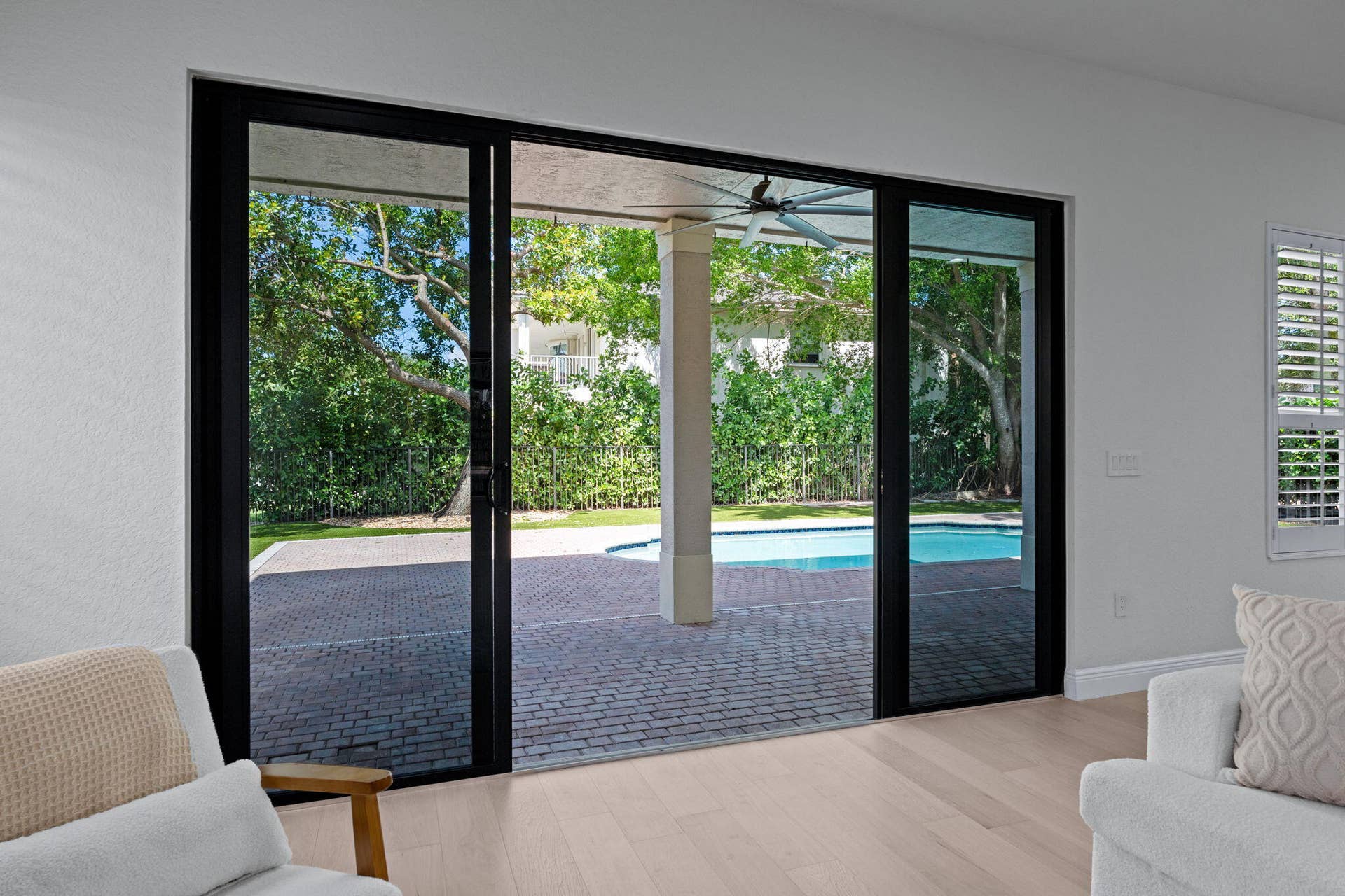 9705 Napoli Woods Lane, Delray Beach, FL 33446 living room impact sliders