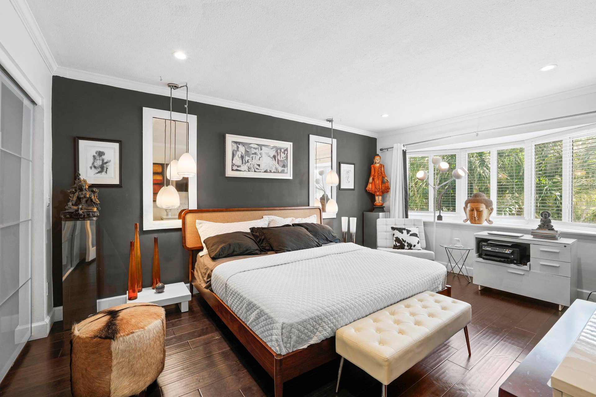 7 Middlesex Drive, Wilton Manors, FL 33305 Recessed lighting illuminates the room, featuring dark wood-finish flooring and a bay window with blinds