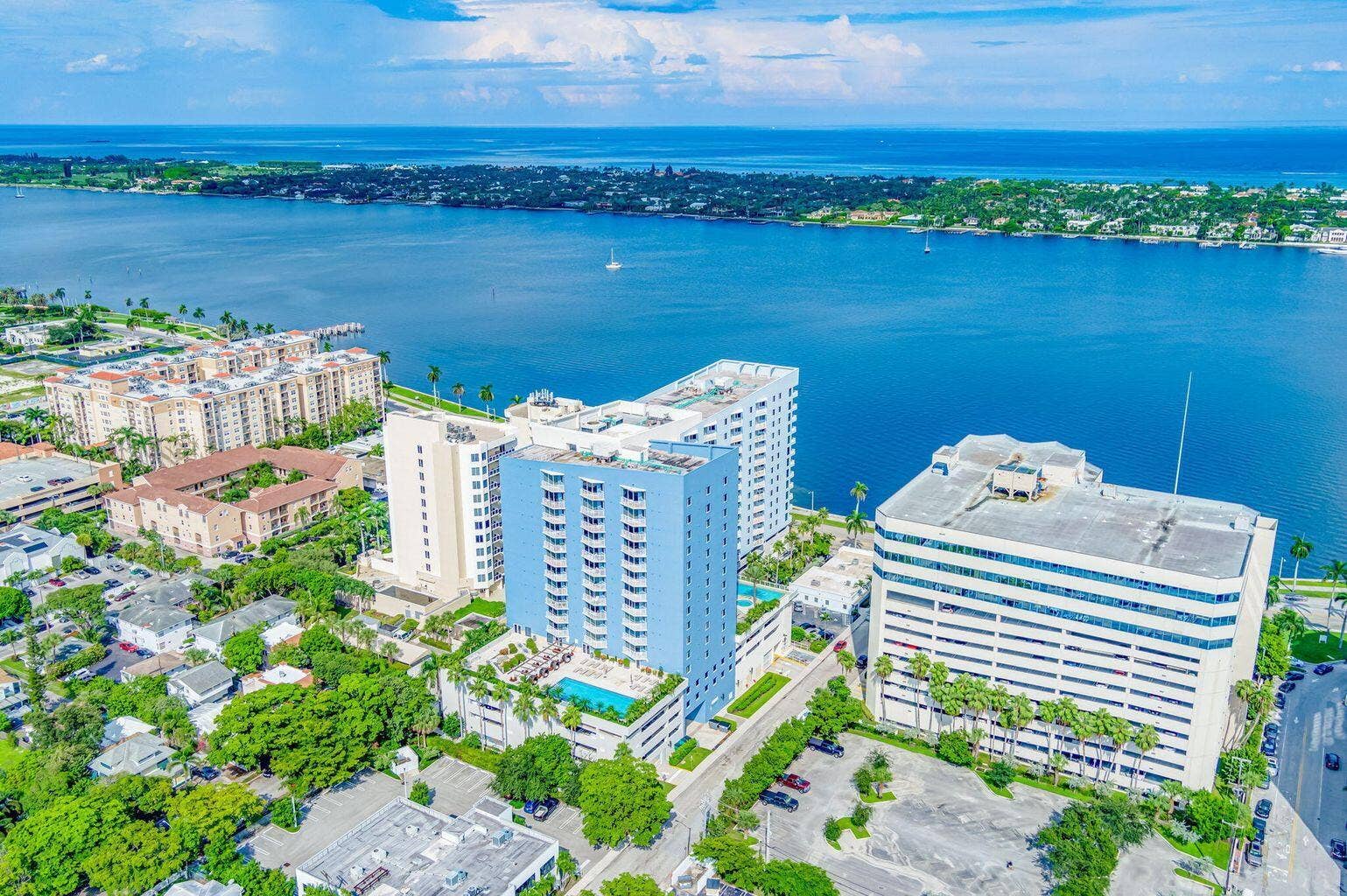 Aerial perspective showcasing waterfront properties with abundant natural light