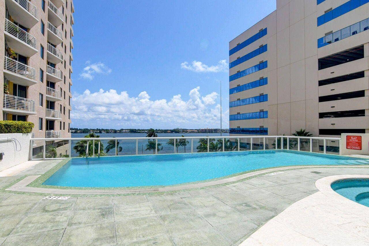 Outdoor swimming pool featuring a curved design and integrated spa