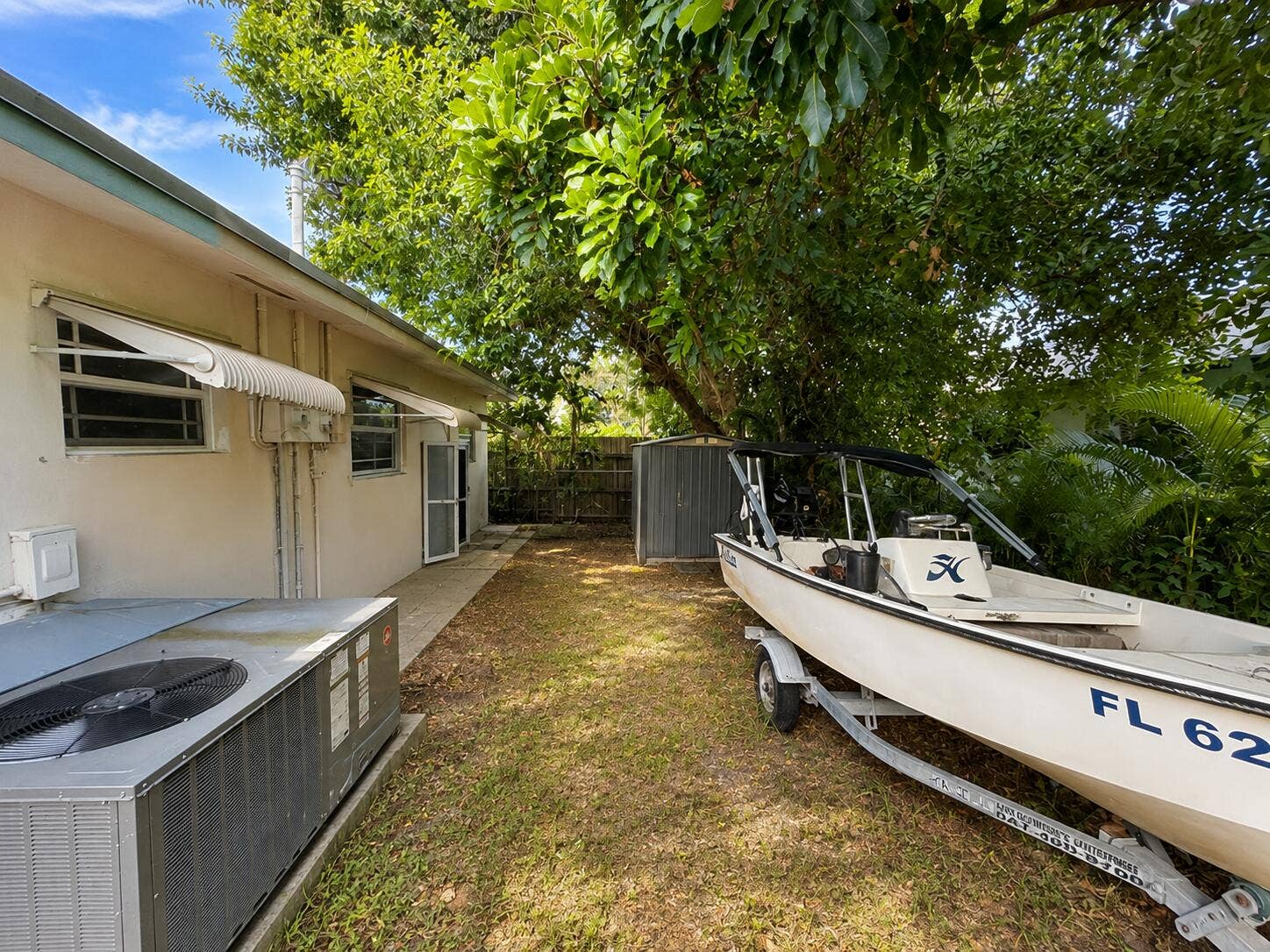 Room for small boat storage on side yard.