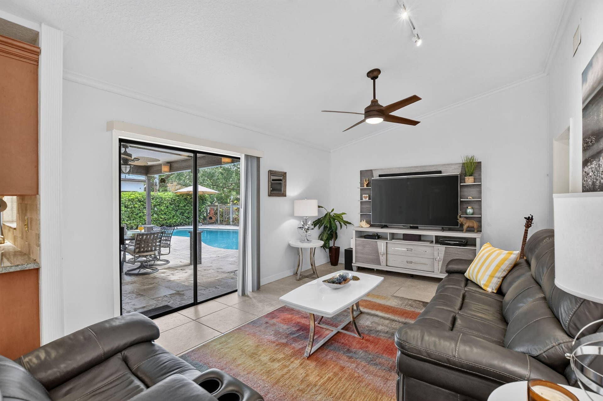 Family room overlooks the oversized paver patio and pool!