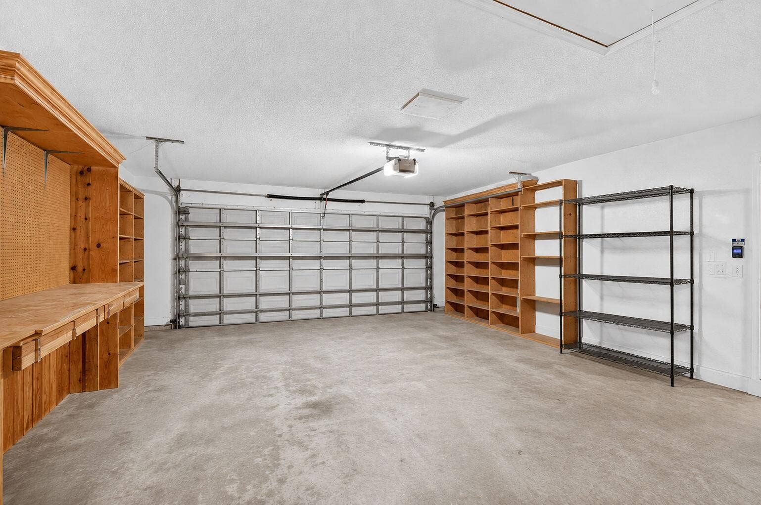 Spacious 2 car garage with hurricane rated door.