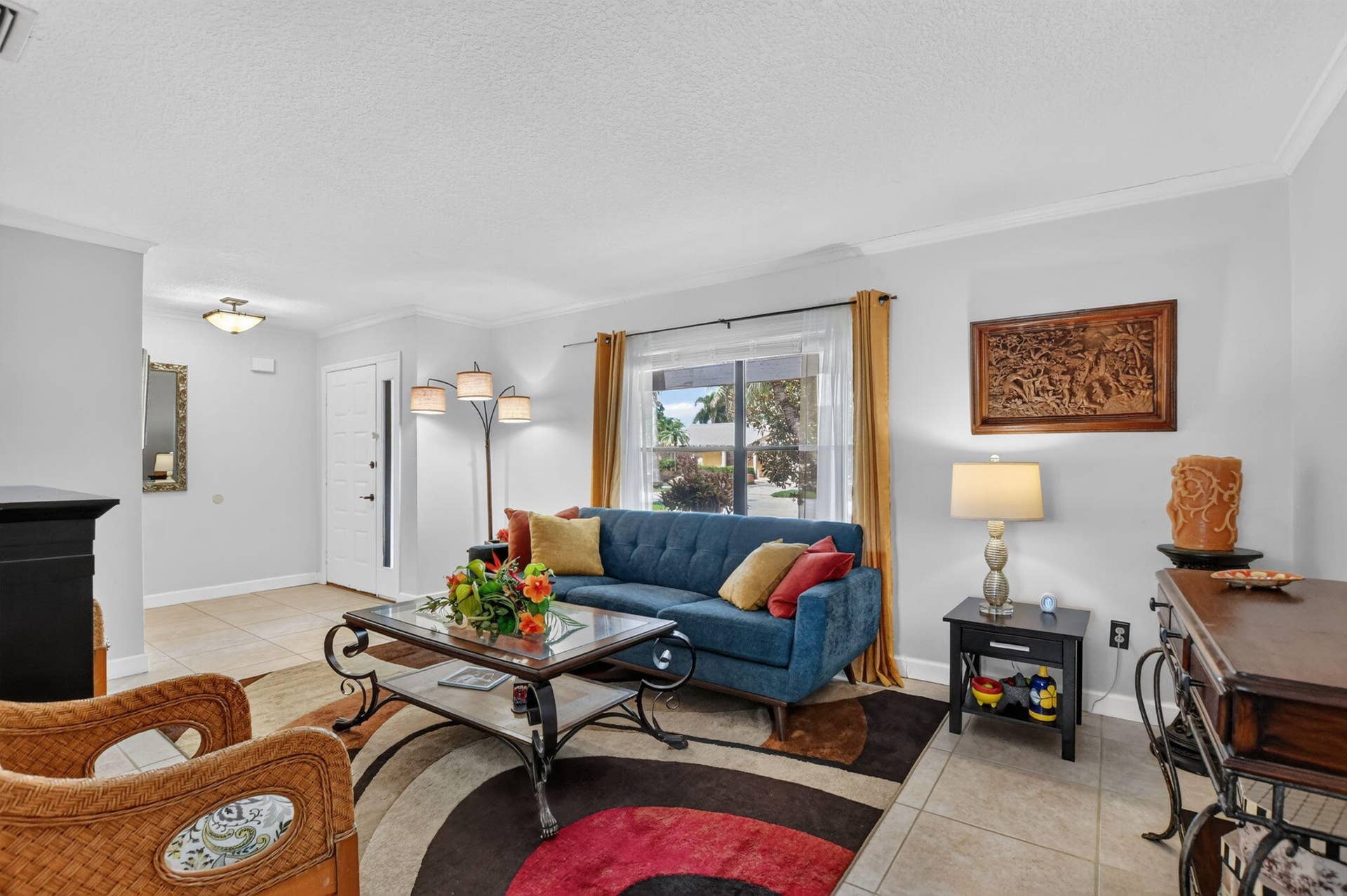 Neutral tile throughout living areas.