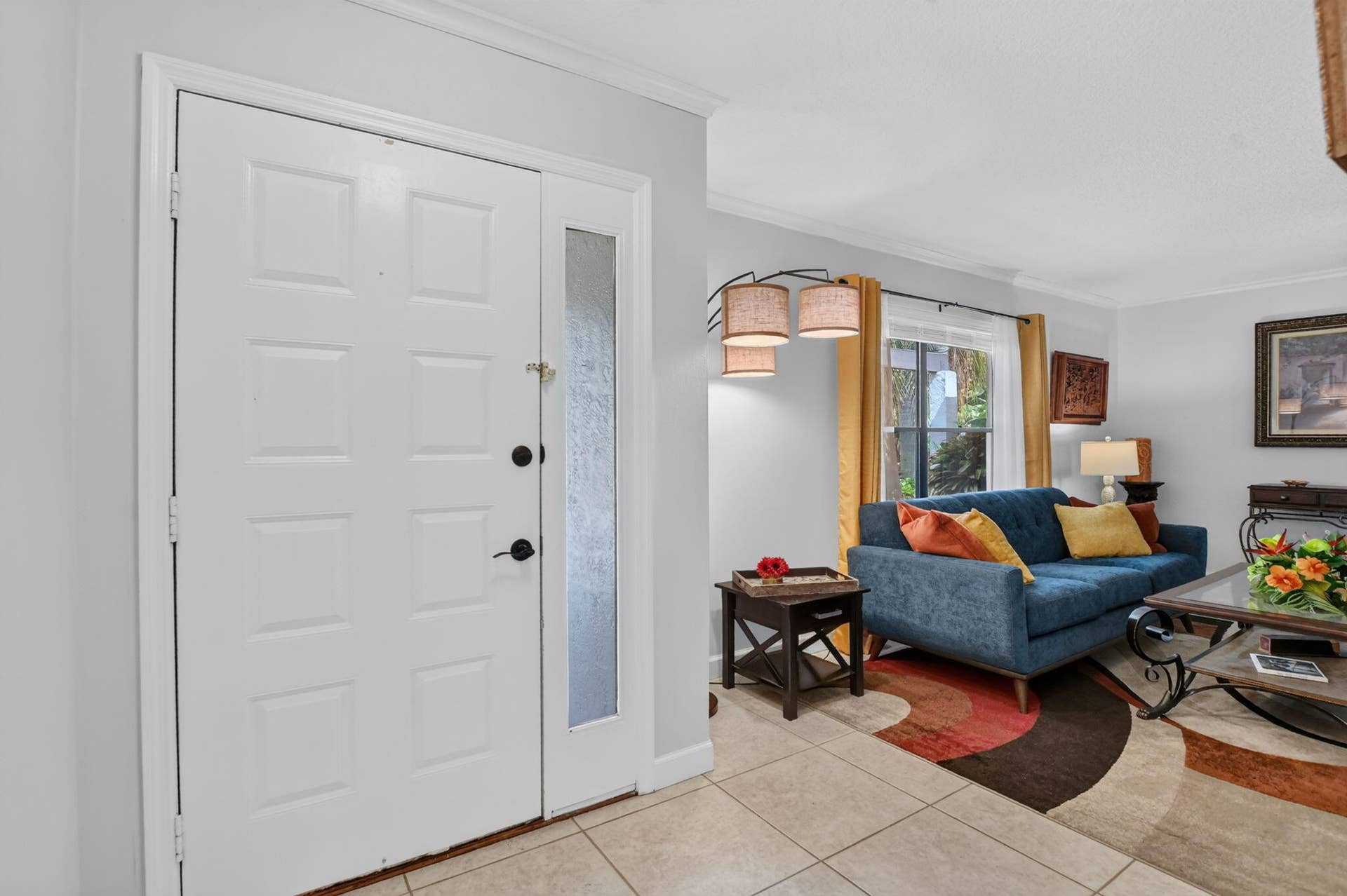 Foyer entry with sidelight invites you to the wide-open floorplan.