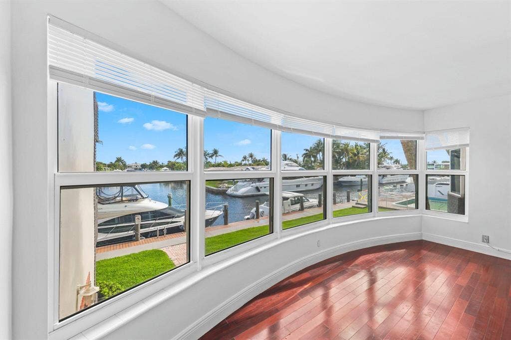 This open concept Living Room, Dining room, Florida Room is very spacious and offers amazing canal views to watch the boats and relax.