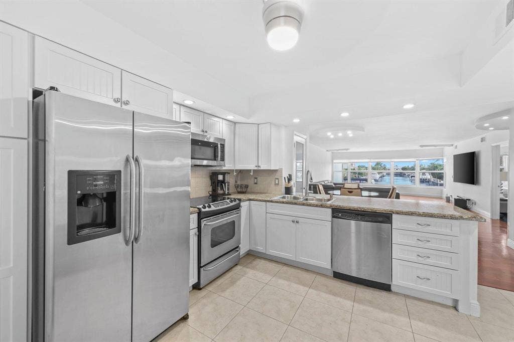 COASTAL LIVING AT ITS BEST FOR BEACH & BOAT LOVERS IN LAUDERDALE BY THE SEA. THIS NICELY REMODELED UNIT FEATURES 1300 SQ FT, 2 BEDROOMS 2 BATHROOMS LOCATED DIRECTLY ON THE CANAL W/ AMAZING WATER VIEWS ONLY 600 FT FROM THE INTRACOASTAL. KITCHEN FEATURES WHITE SHAKER CABINETS, STAINLESS STEEL APPLIANCES W/ GRANITE COUNTERTOPS, & IN UNIT WASHER/ DRYER. PRIMARY BEDROOM ALSO HAS WATER VIEWS W/ WALK IN CUSTOM CALIFORNIA STYLE CLOSET. UPDATED BATHROOMS, NO FIXED BRIDGES, 3 HEATED POOLS, 3 BBQ AREAS, TIKI HUT.