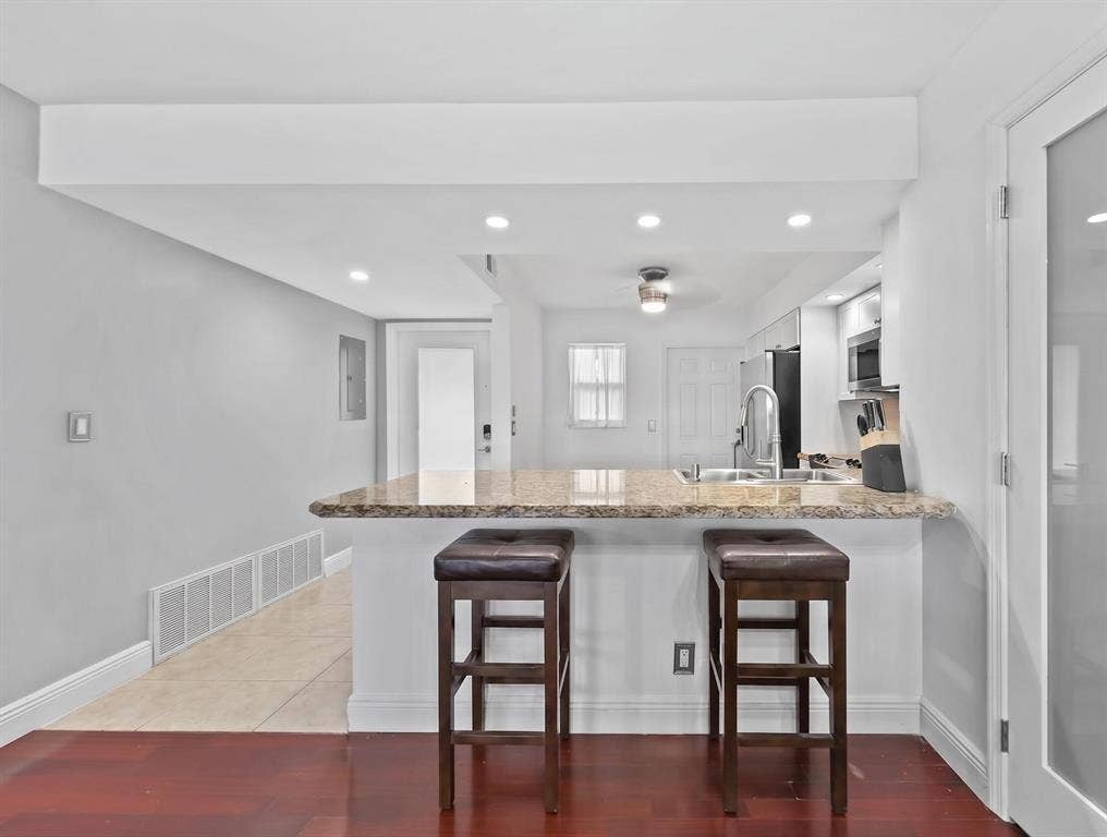 Kitchen with eat in breakfast bar