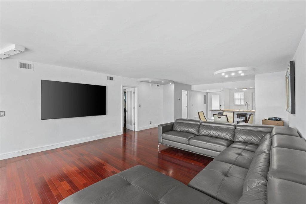 This open concept Living Room, Dining room, Florida Room is very spacious and offers amazing canal views to watch the boats and relax.