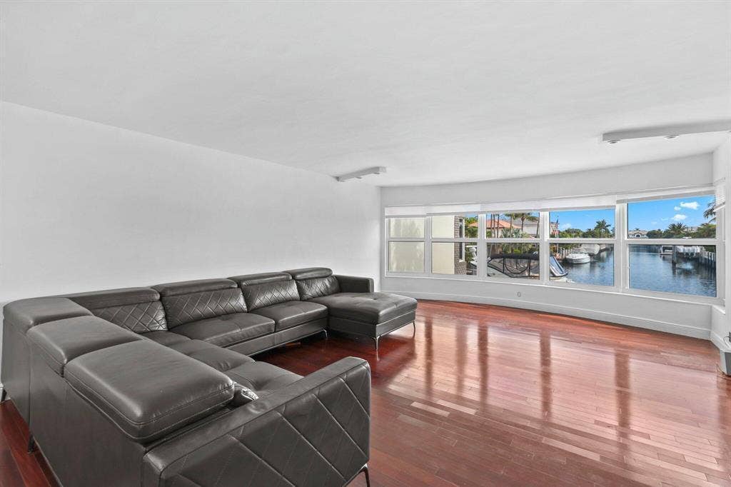 This open concept Living Room, Dining room, Florida Room is very spacious and offers amazing canal views to watch the boats and relax.