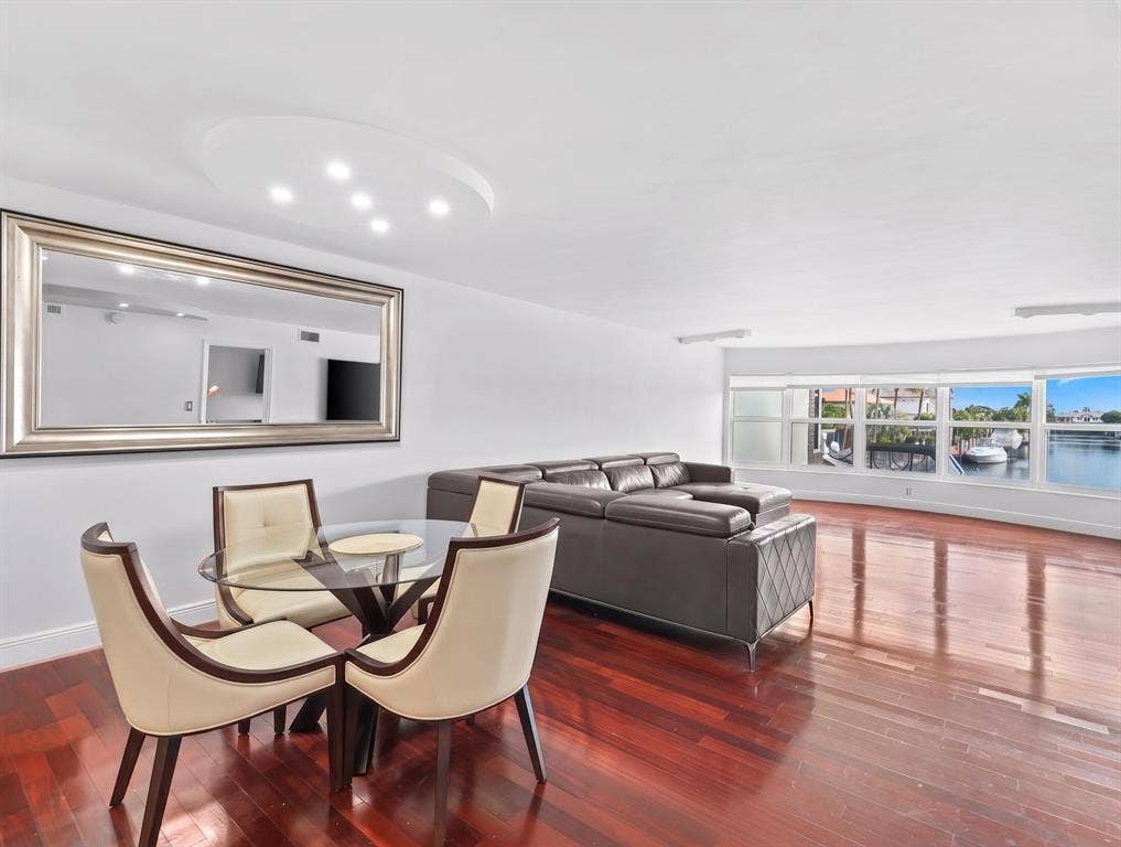 This open concept Living Room, Dining room, Florida Room is very spacious and offers amazing canal views to watch the boats and relax.