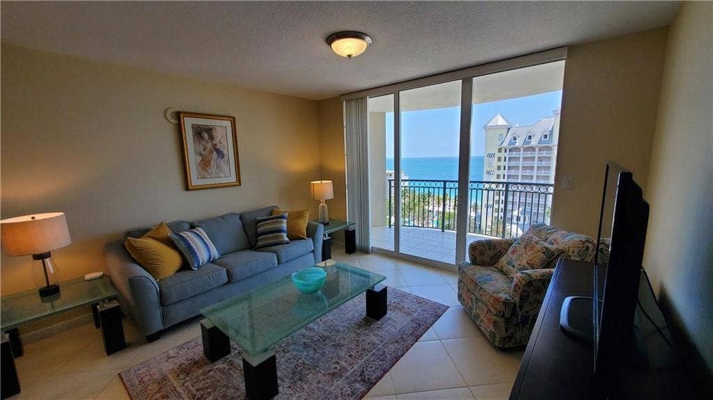 2001 N OCEAN Boulevard, #1106, Fort Lauderdale, FL 33305 Spacious living room with a balcony facing the ocean ...