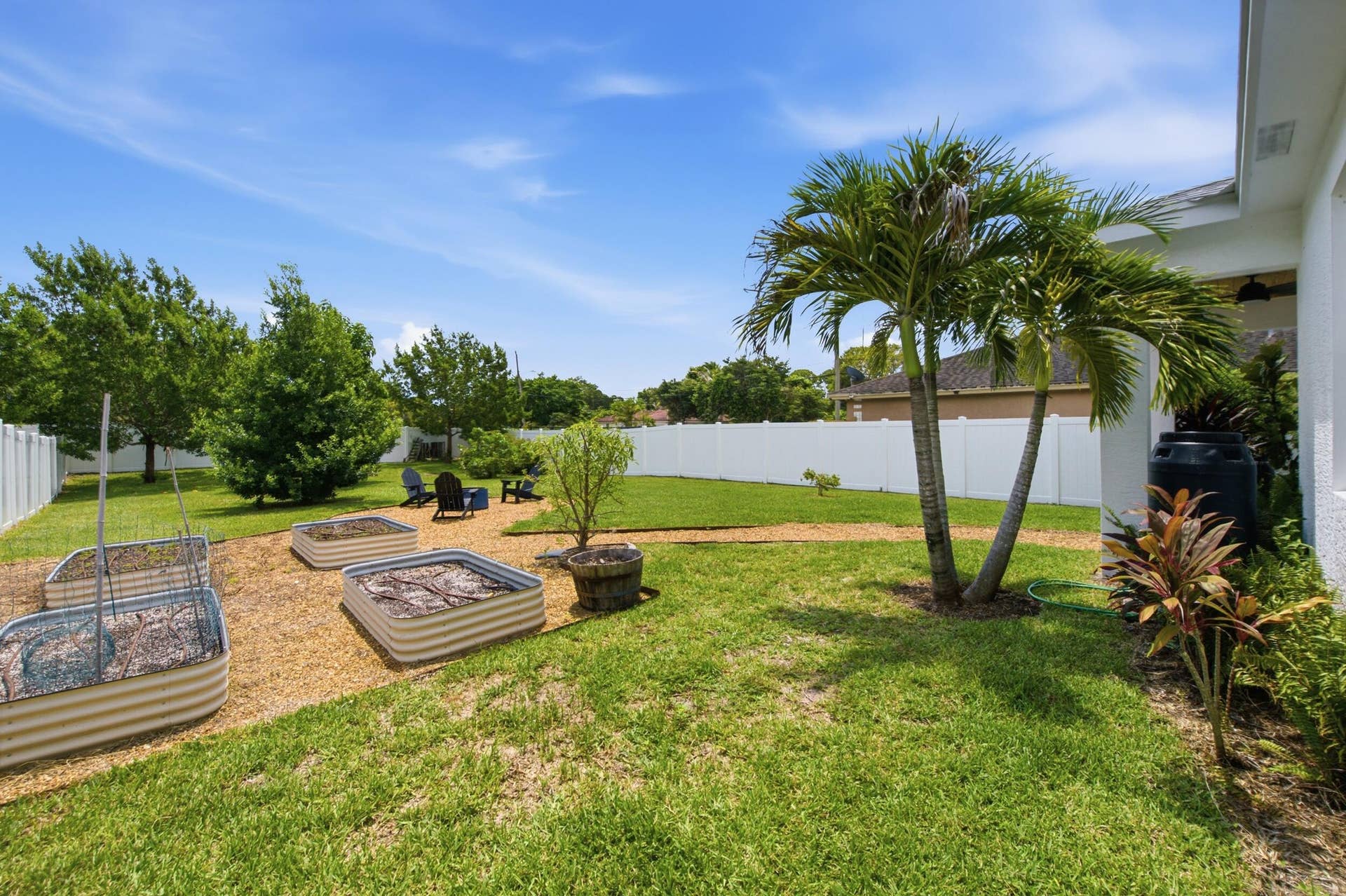 18302 Limestone Creek Road, Jupiter, FL 33458 Unwind around the fire pit in the private, fully fenced back yard. All the hard work of installing the raised bed garden is done! It's a blank slate for you to plant the garden of your dreams.