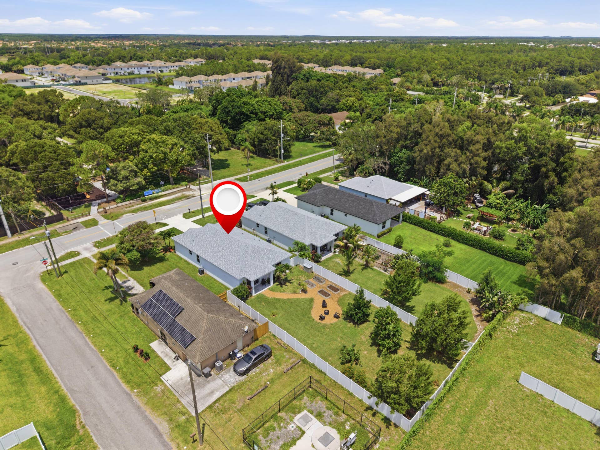 18302 Limestone Creek Road, Jupiter, FL 33458 Directly across the street from Limestone Creek's park featuring a basketball court, playground, trail, open greenery and picnic area