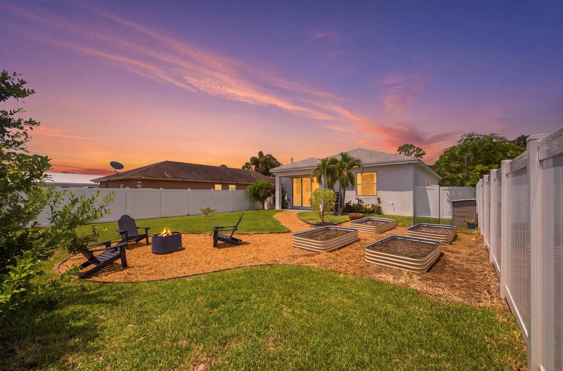 18302 Limestone Creek Road, Jupiter, FL 33458 Unwind around the fire pit in the private, fully fenced back yard. All the hard work of installing the raised bed garden is done! It's a blank slate for you to plant the garden of your dreams.