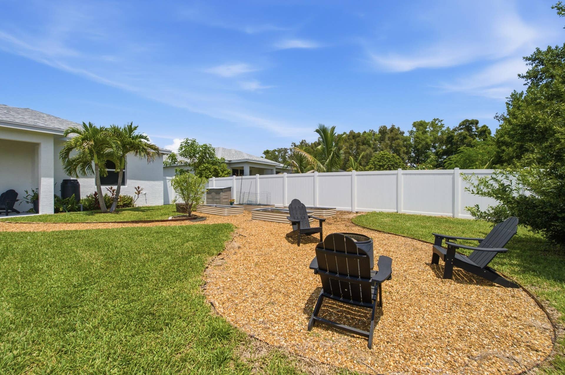 18302 Limestone Creek Road, Jupiter, FL 33458 Unwind around the fire pit in the private, fully fenced back yard. All the hard work of installing the raised bed garden is done! It's a blank slate for you to plant the garden of your dreams.